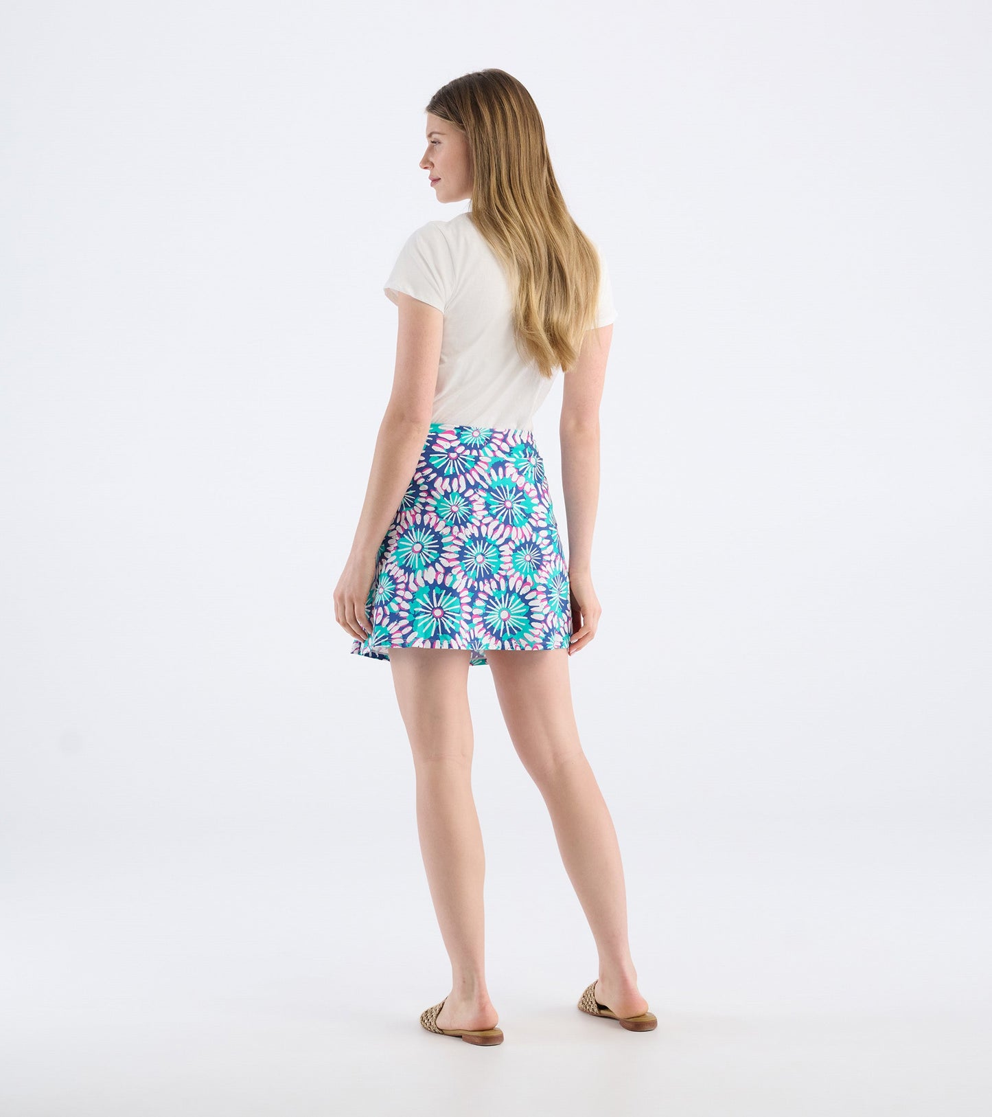 Colorful sundial mandala skort with a flared design, featuring a vibrant floral pattern in blue, pink, and green.