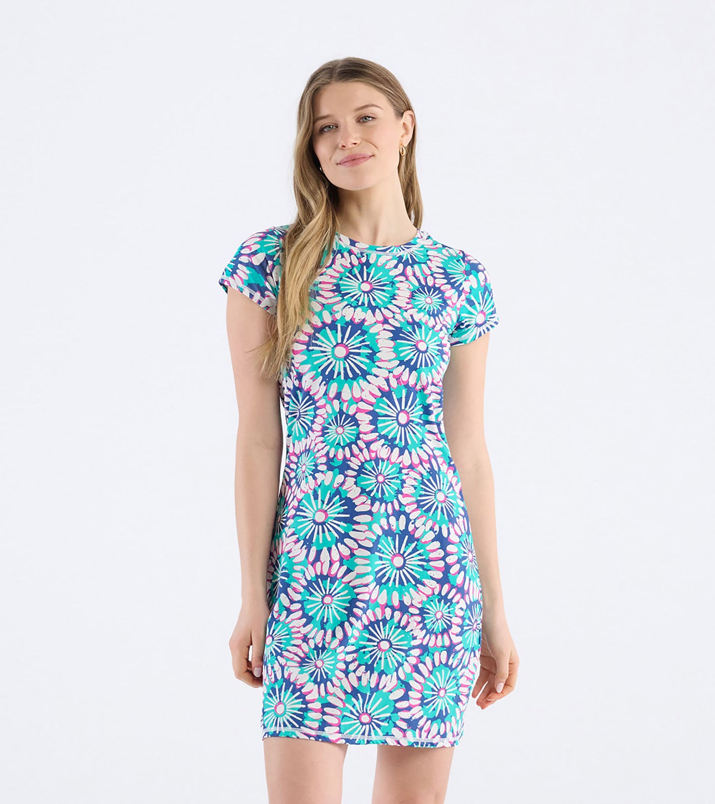 Short-sleeve t-shirt dress featuring a colorful sundial mandala pattern in shades of blue, pink, and green.