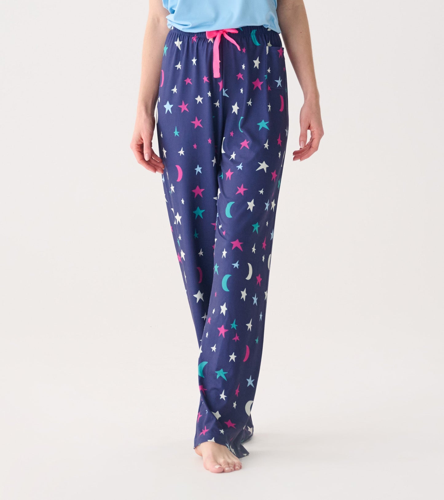 Navy polyknit pajama pants featuring colorful stars and moons, with an elastic waistband and drawstring.
