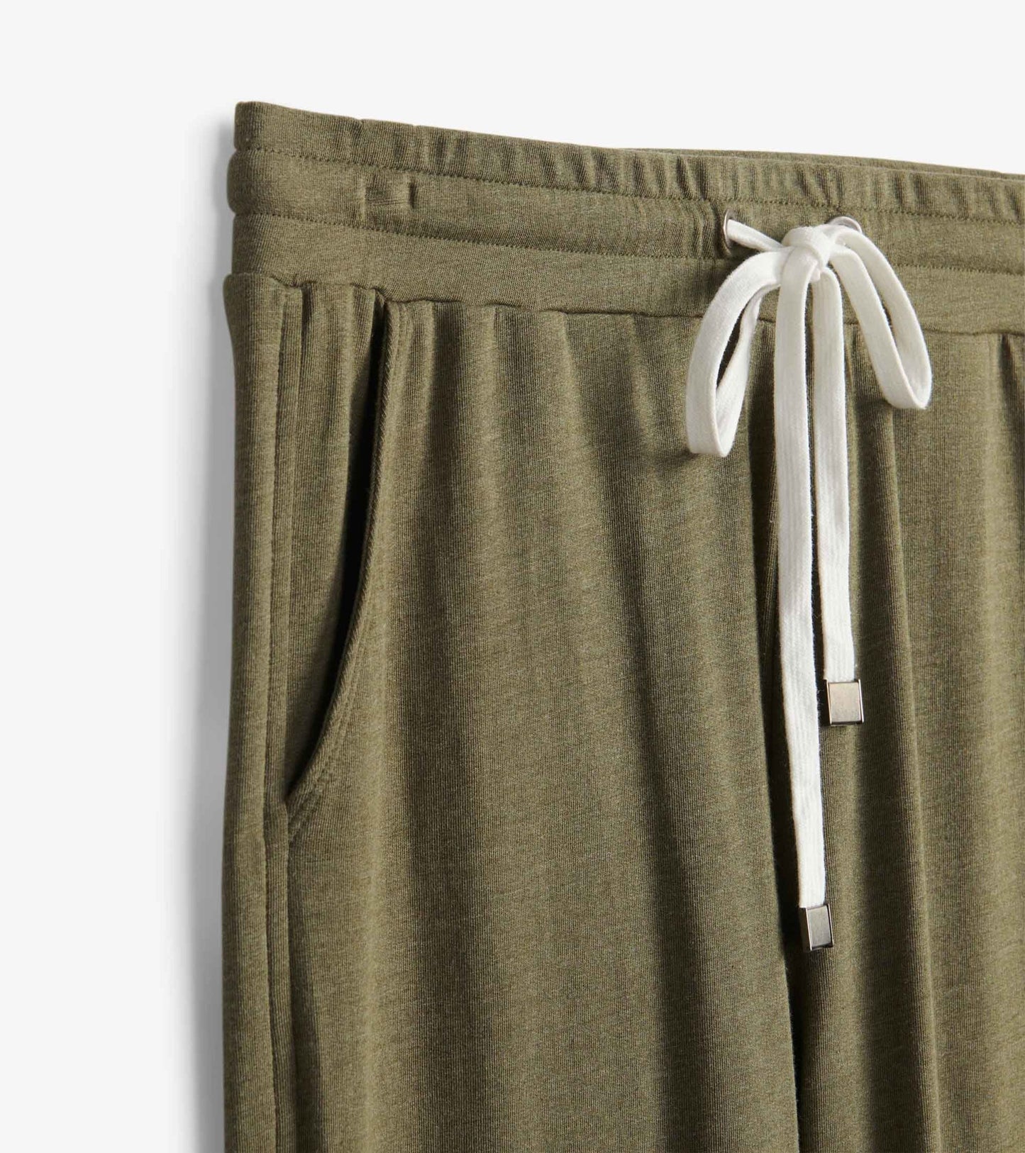 Loden green melange joggers with a drawstring waist and side pockets, showcasing a soft, relaxed fit.