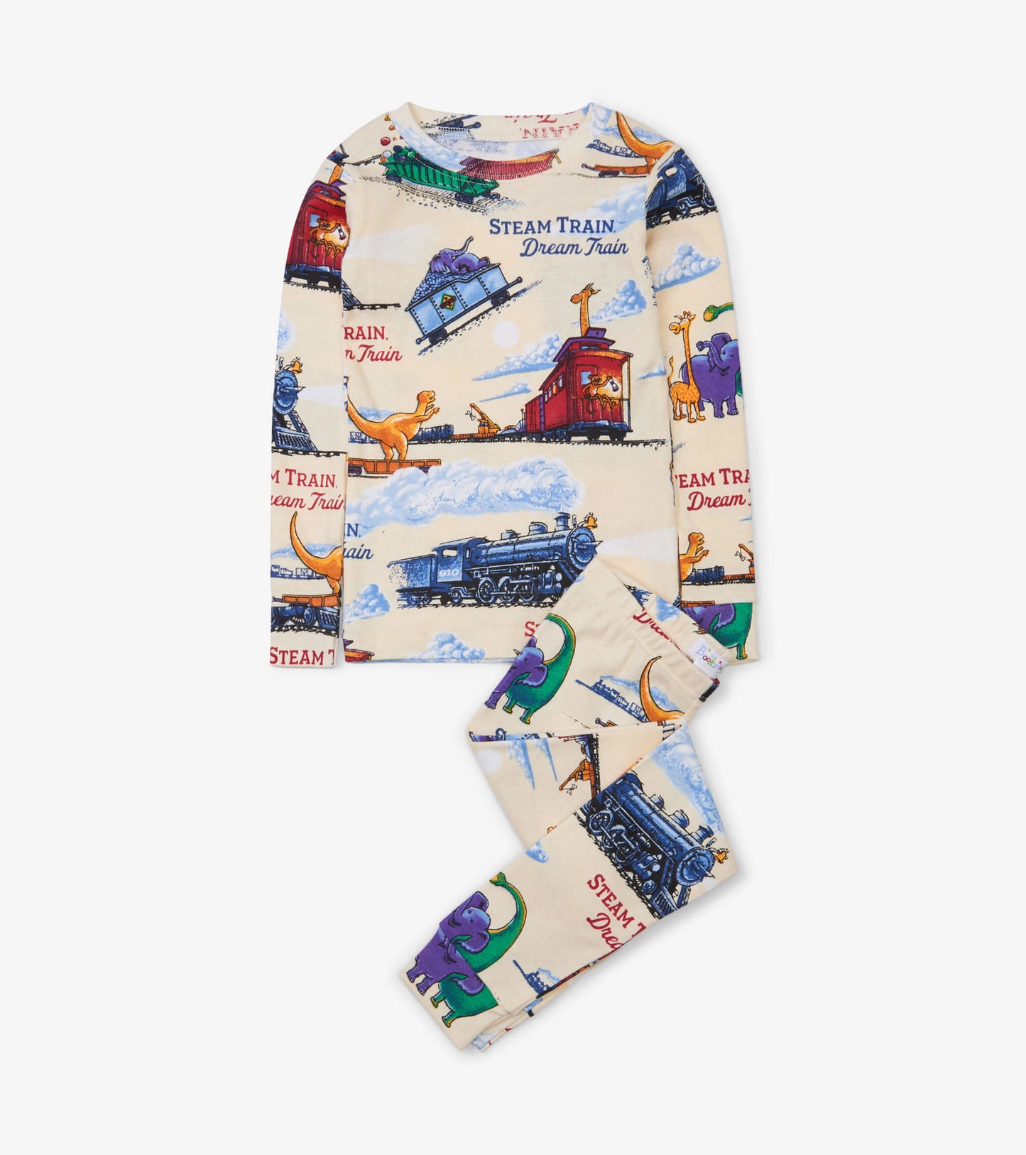 Cream pajama set featuring colorful train and dinosaur prints, includes long-sleeve top and matching pants.