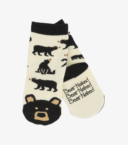 Cream socks featuring black bear patterns and a bear face design on the toe, suitable for kids ages 2-7.