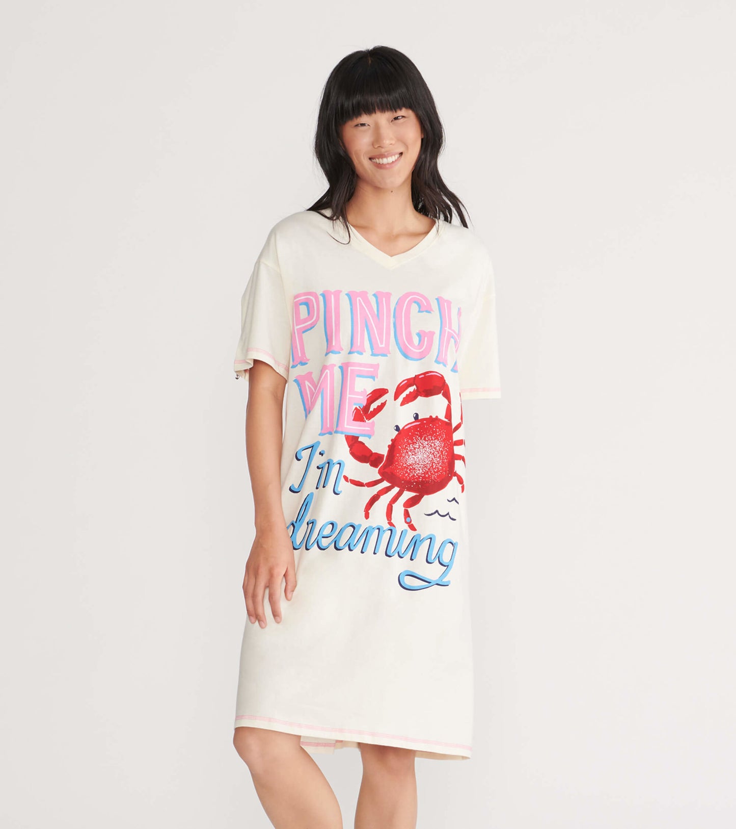 Light cream sleepshirt featuring a colorful crab graphic and playful text, with a relaxed fit and short sleeves.