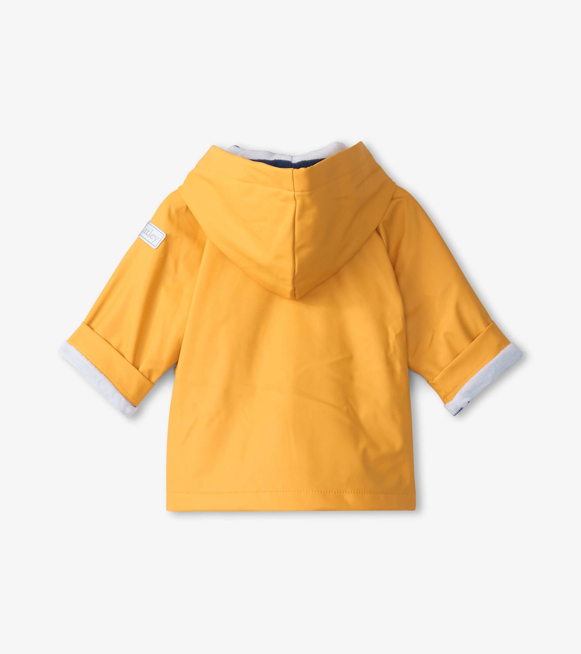 Yellow baby raincoat with a hood and rolled sleeves, made from waterproof material, shown from the back.