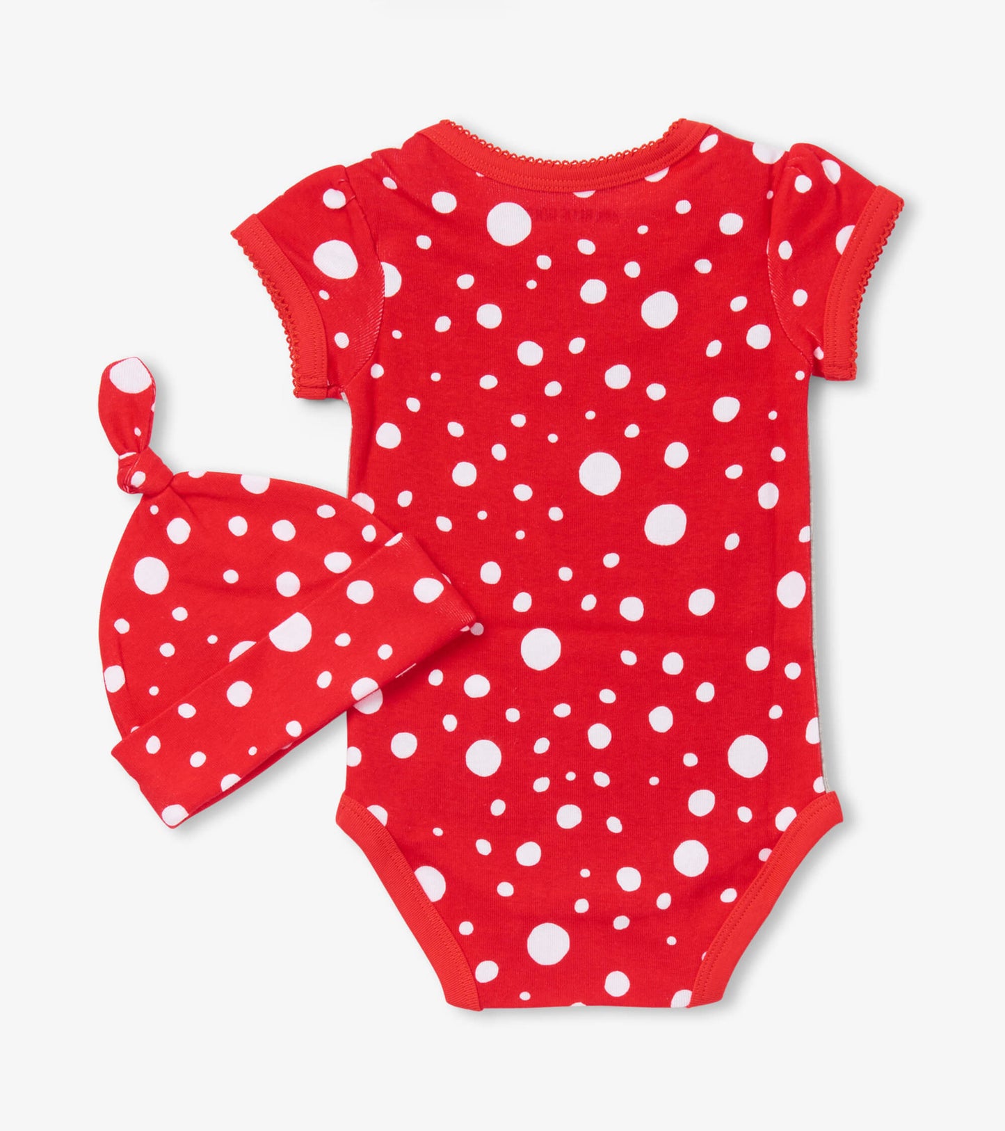 Red short-sleeve bodysuit with white polka dots, paired with a matching knot hat. Suitable for infants.