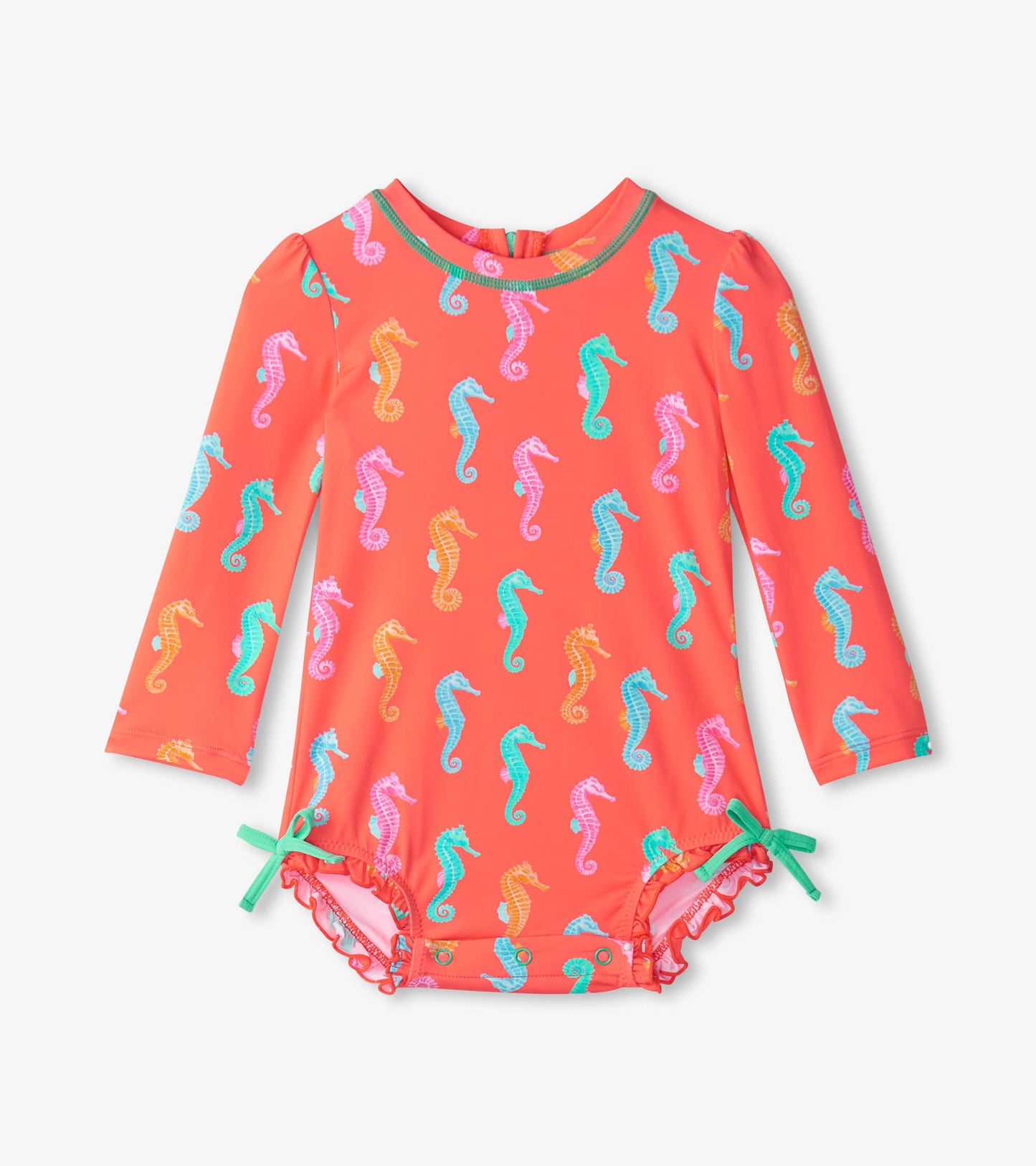 Coral rashguard swimsuit for baby girls, featuring colorful seahorse patterns and ruffled edges with adjustable ties.