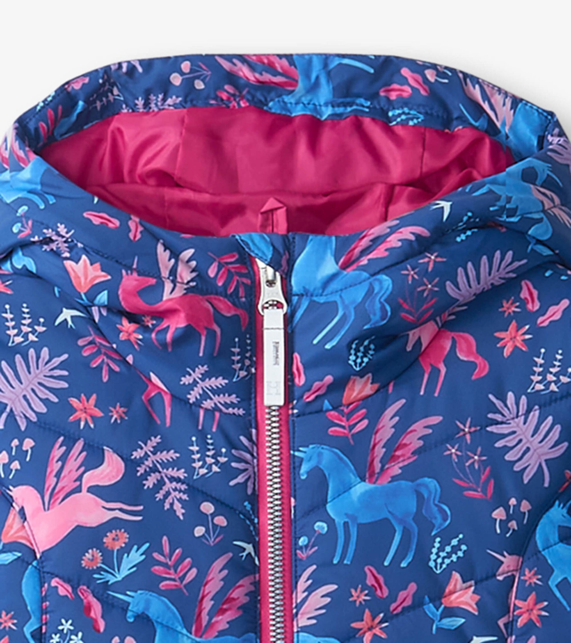 Blue puffer jacket featuring a whimsical unicorn and floral pattern, with a pink interior and front zipper.