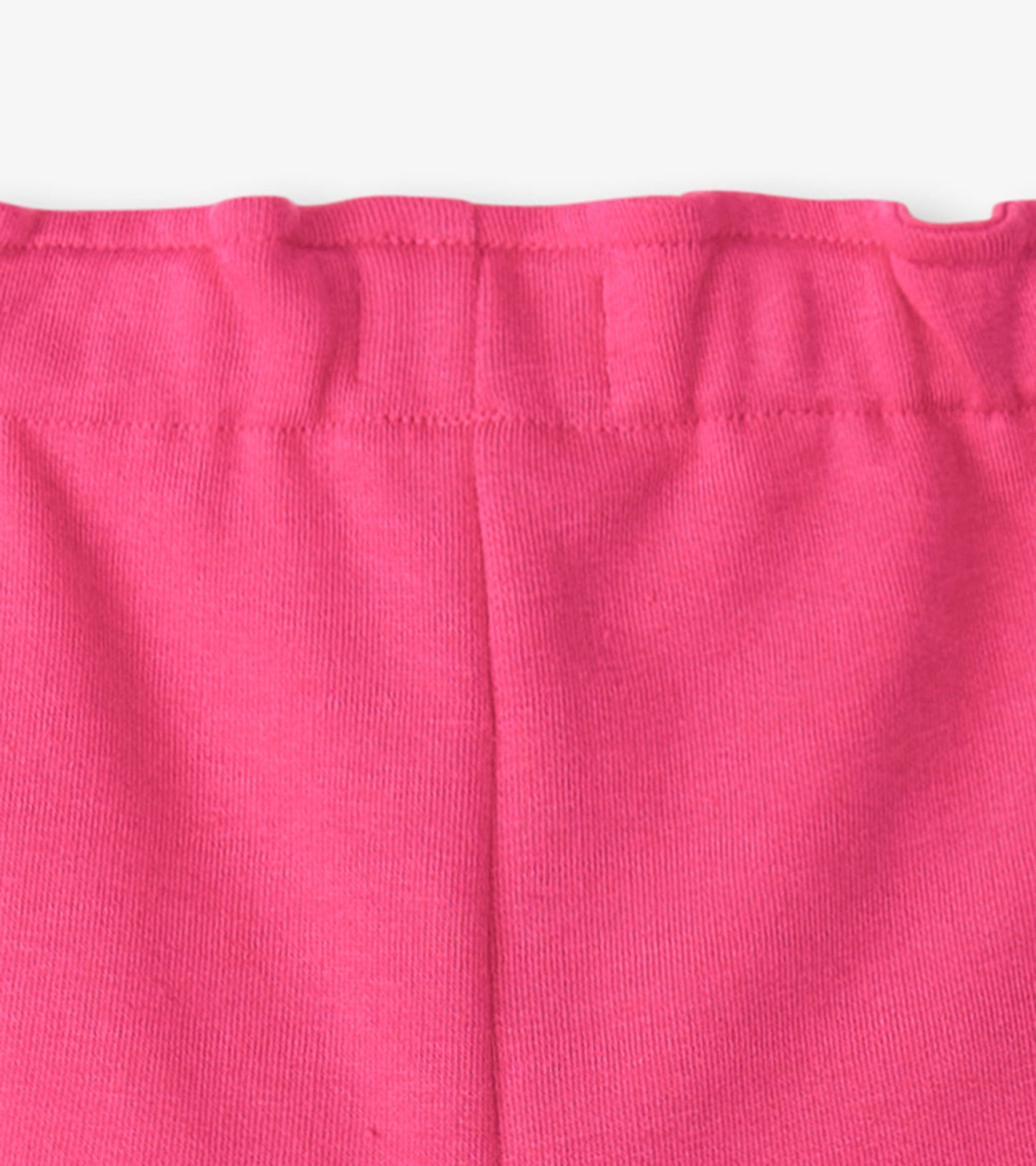 Bright pink paper bag shorts with a gathered waistband, suitable for casual wear.