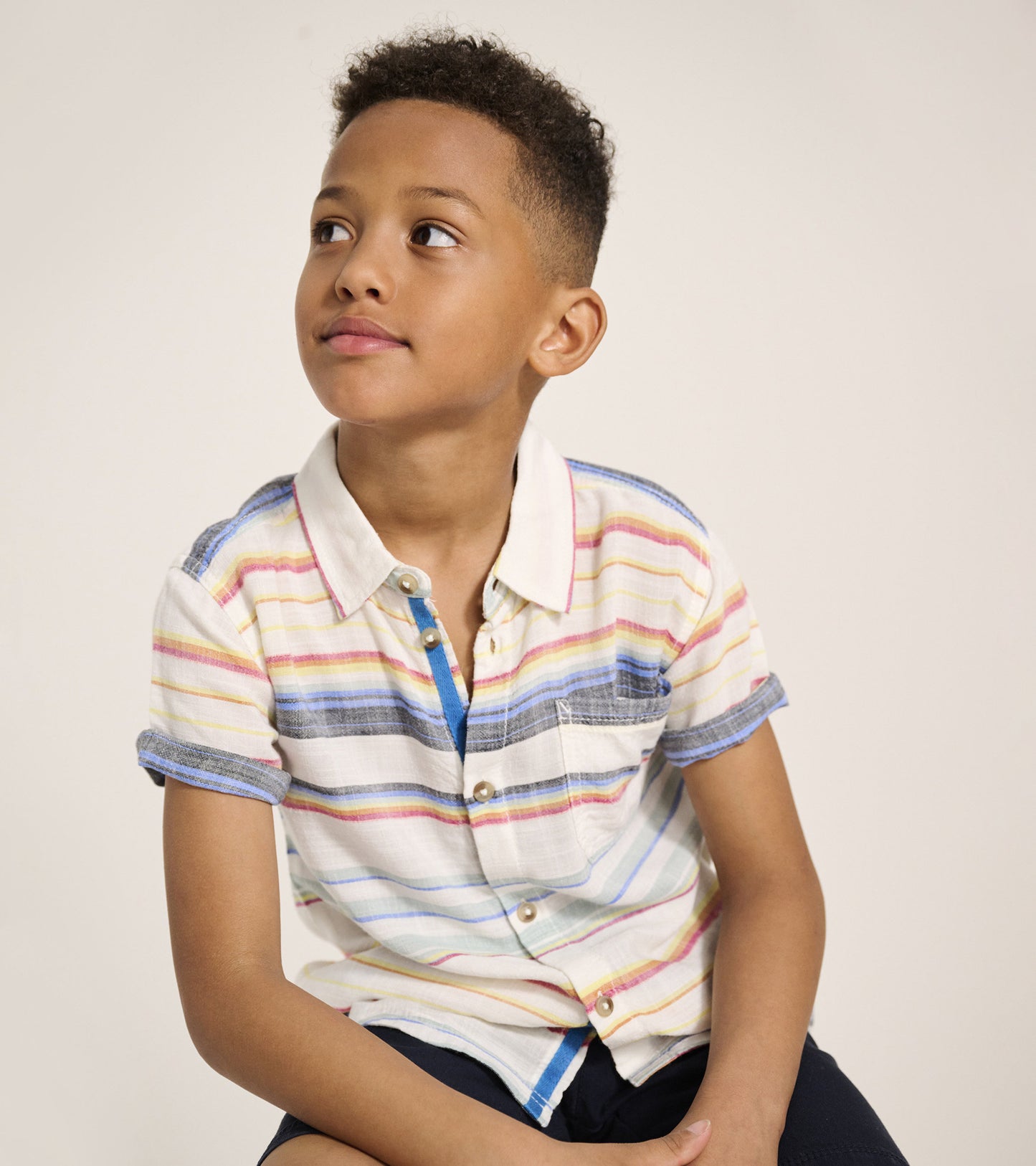Short sleeve button-down shirt featuring colorful horizontal stripes and a chest pocket, perfect for summer wear.