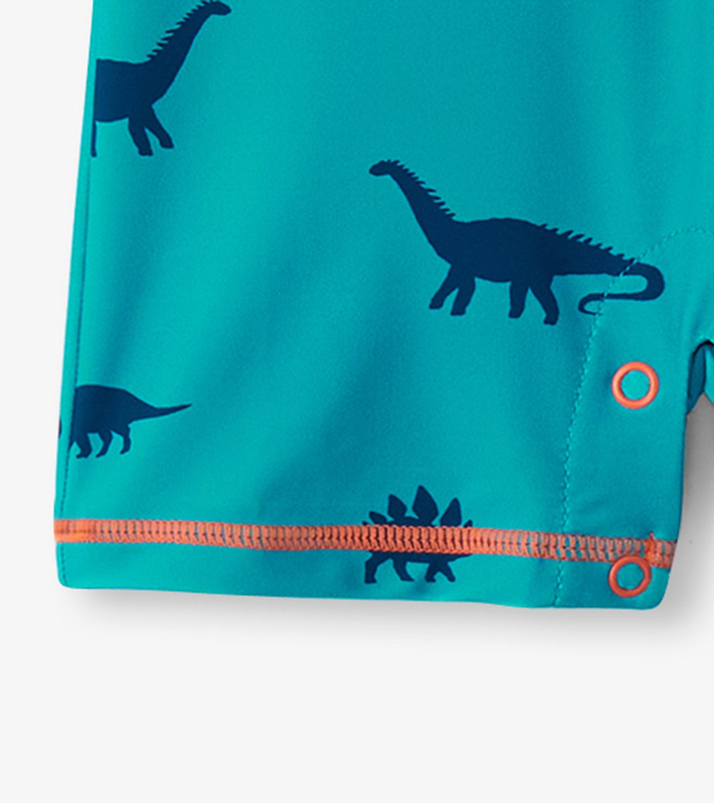Turquoise one-piece rashguard featuring navy dinosaur silhouettes and orange trim, suitable for baby boys.