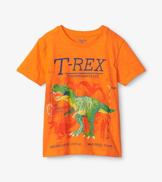 Orange graphic tee featuring a T-Rex design with skeleton details and text about its size and speed.