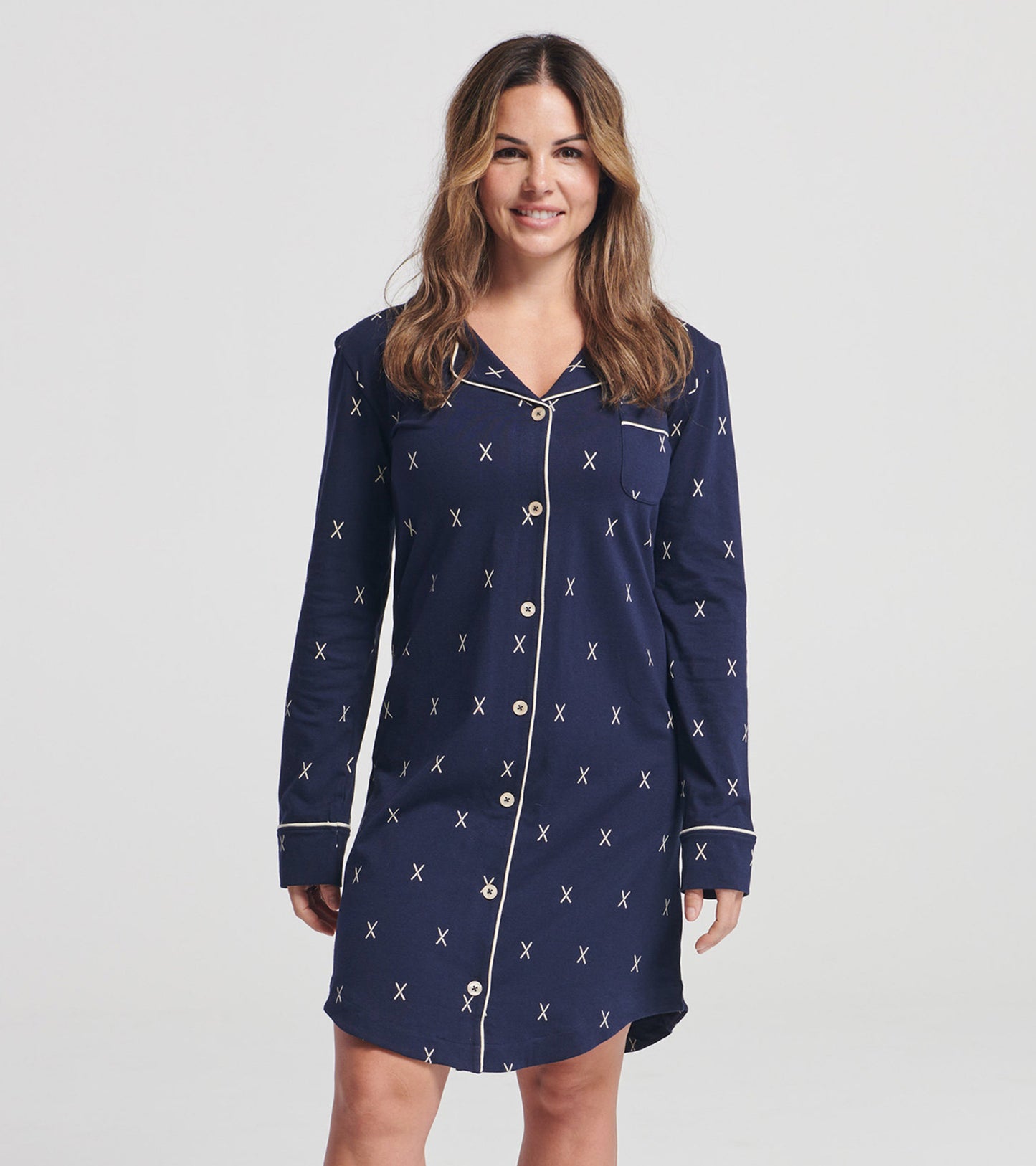 Navy long-sleeve nightgown with a button front and contrasting trim, featuring a pattern of small X shapes.