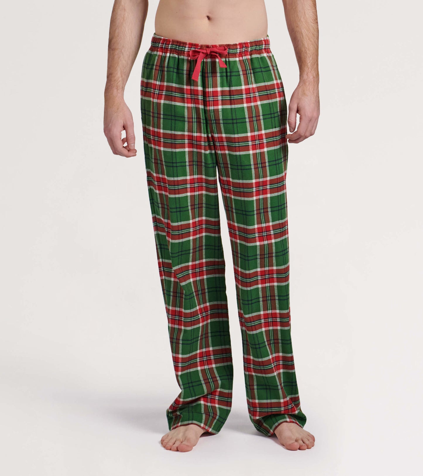 Green flannel pajama pants with red and white plaid pattern, featuring an elastic waistband and drawstring.
