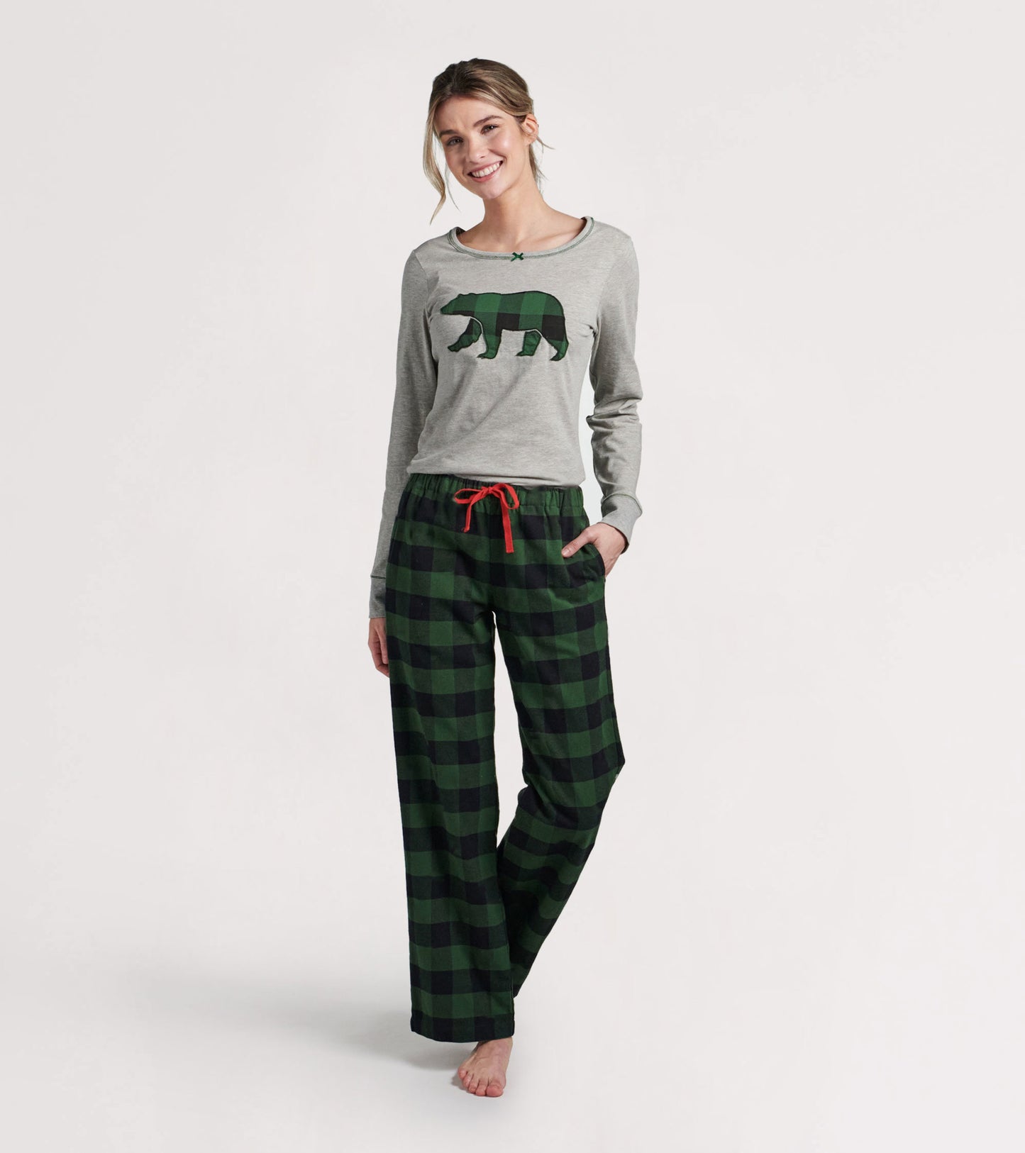 Forest green plaid long pants paired with a gray top featuring a bear graphic, ideal for casual wear.