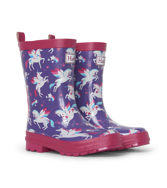 Shiny purple rain boots featuring a unicorn and star pattern, with pink accents and a textured sole.
