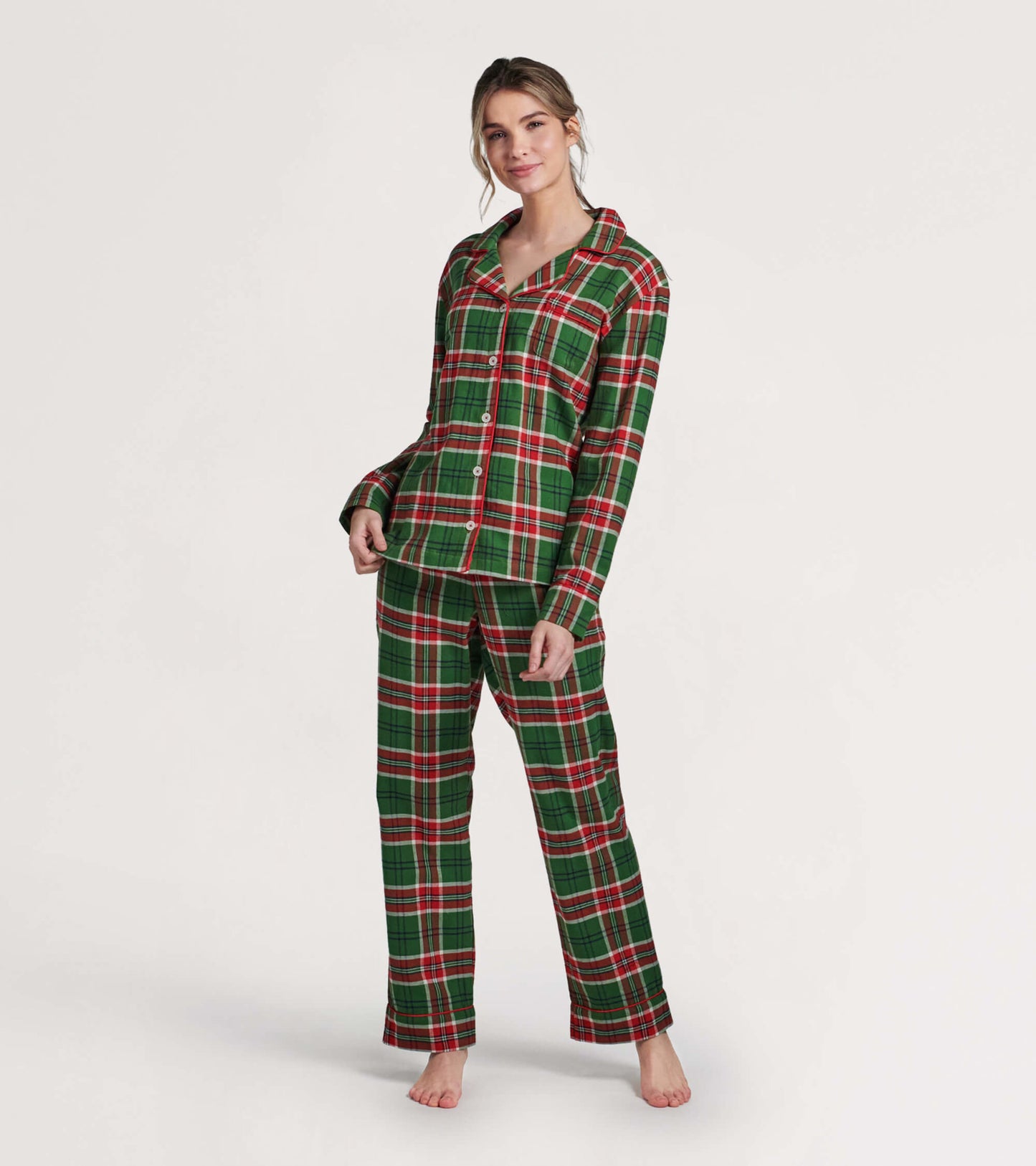 Green and red plaid flannel pajama set featuring a button-up top and matching pants, suitable for cozy winter nights.