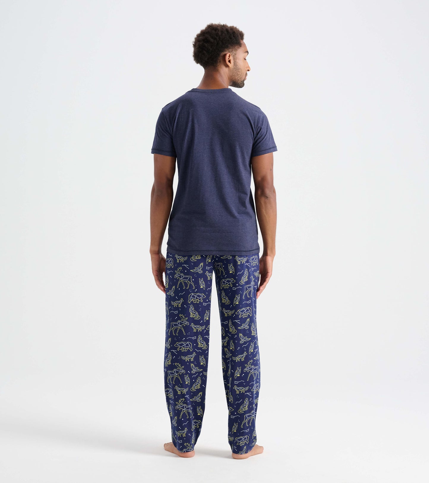 Men's cotton pajama pants in navy with animal constellation print, featuring a relaxed fit and elastic waistband.