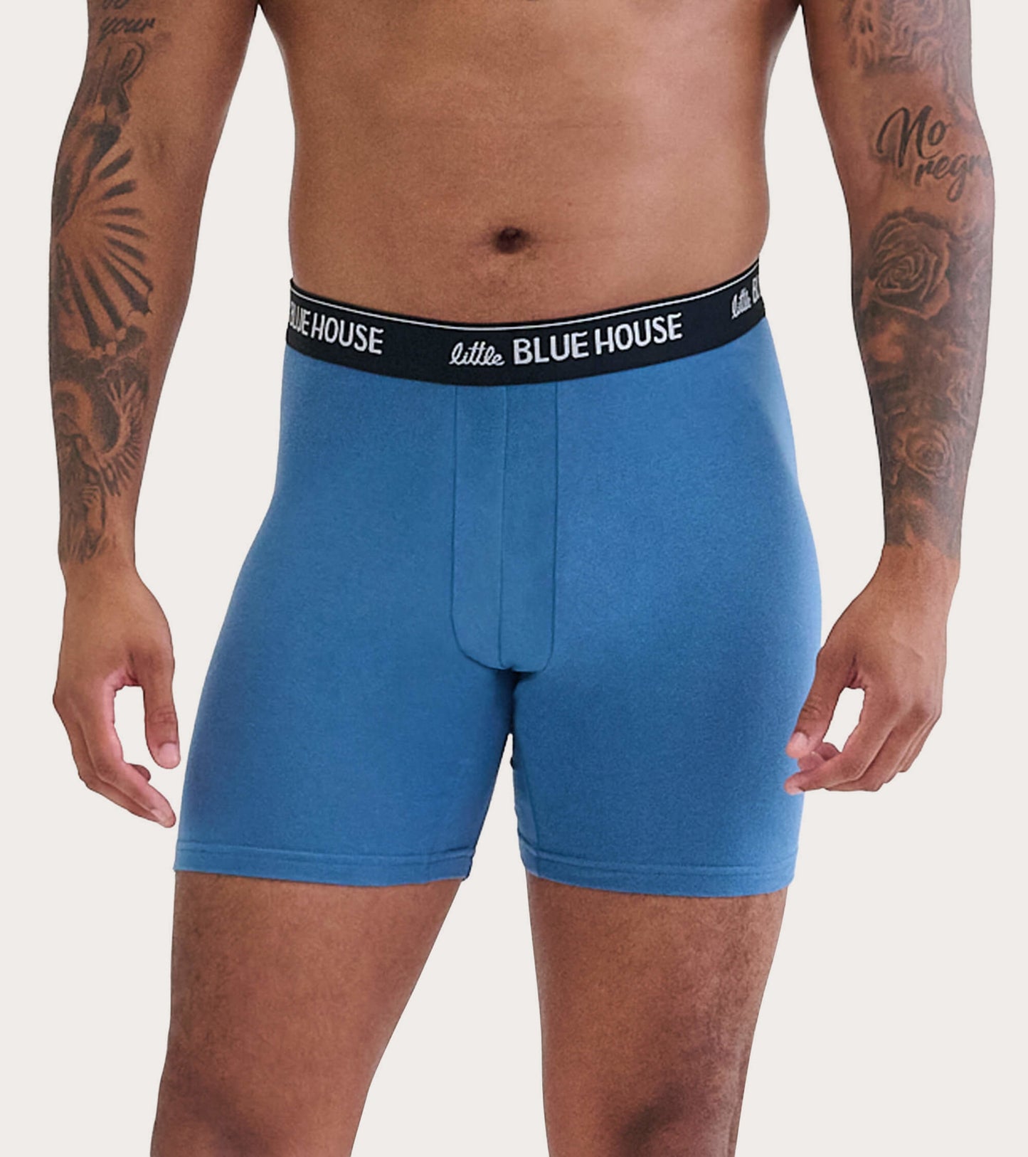 Blue men's boxer briefs with a black waistband, featuring a snug fit and a front pouch.