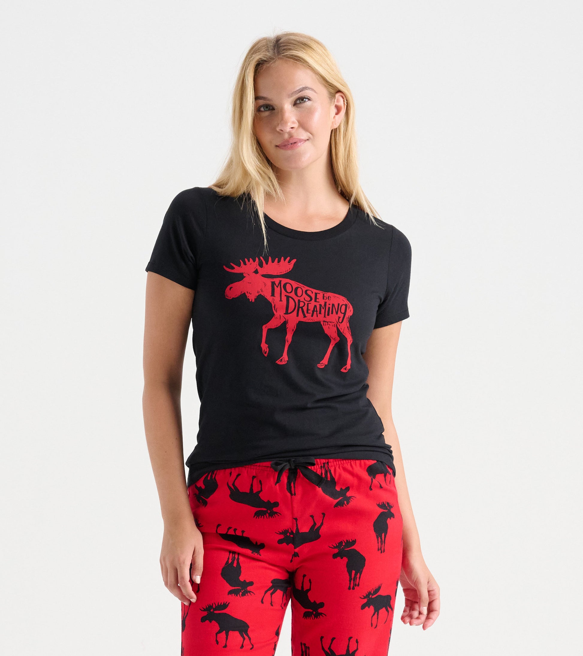 Black pajama t-shirt featuring a red moose graphic, paired with red pants adorned with black moose silhouettes.