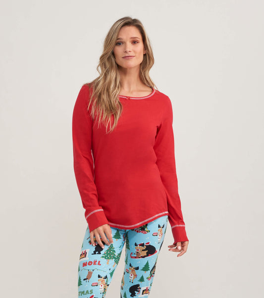 Red long sleeve pajama top with a rounded neckline and contrasting trim, styled for comfortable loungewear.