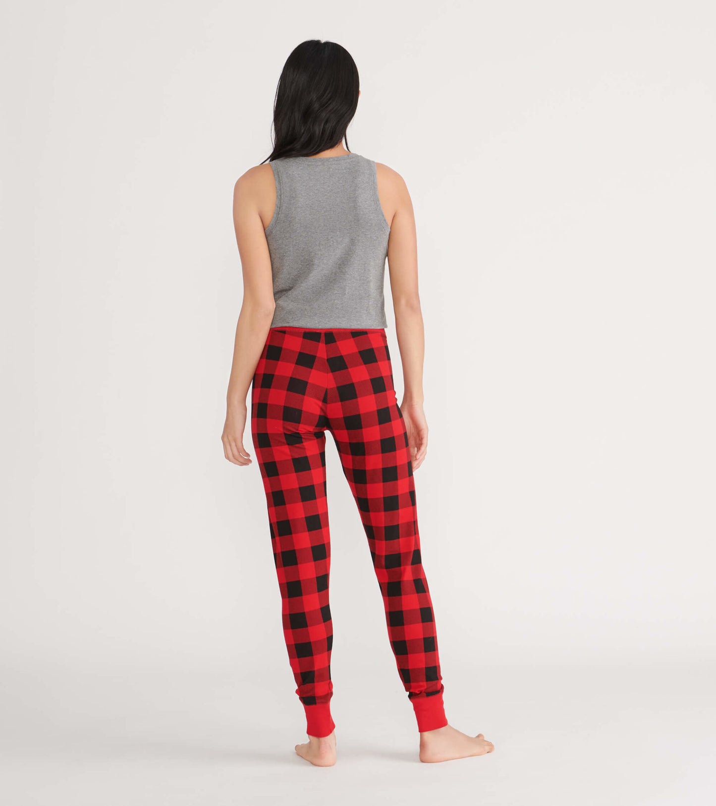 Gray tank top paired with red and black plaid pajama pants, shown from the back.