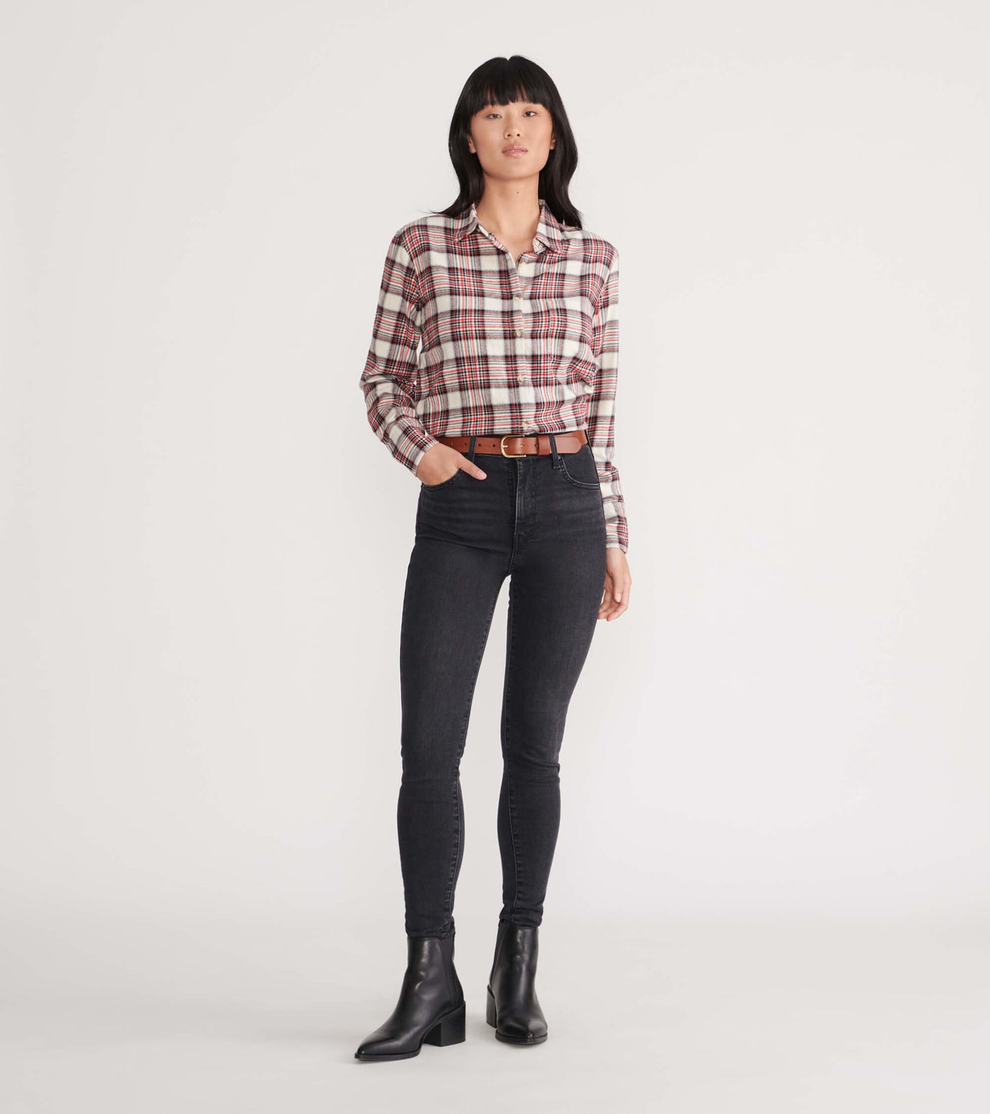 Cream plaid flannel shirt with long sleeves, button-up front, worn with black skinny jeans and ankle boots.