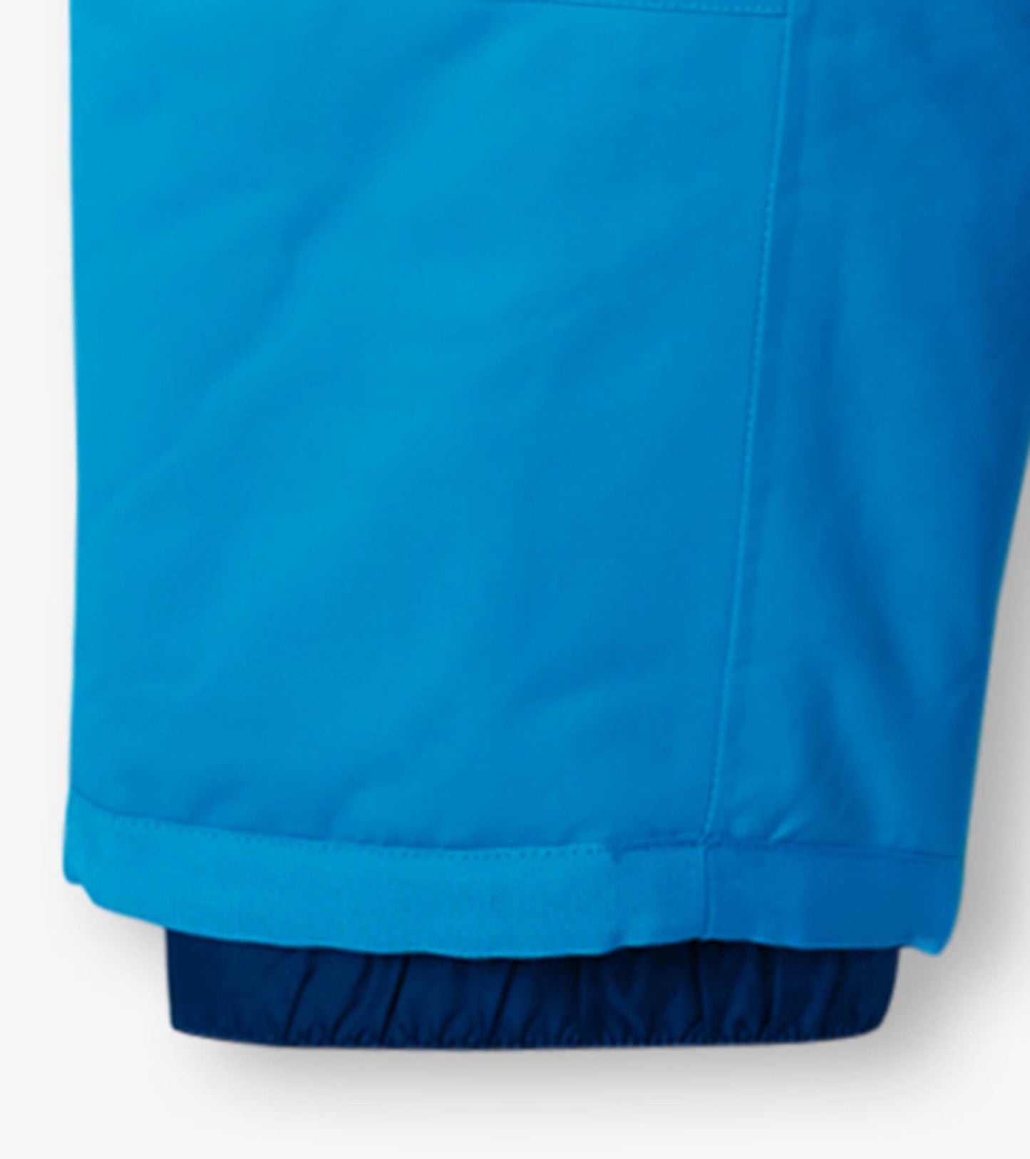 Sky blue toddler snowsuit with elastic cuffs and a smooth, water-resistant fabric.