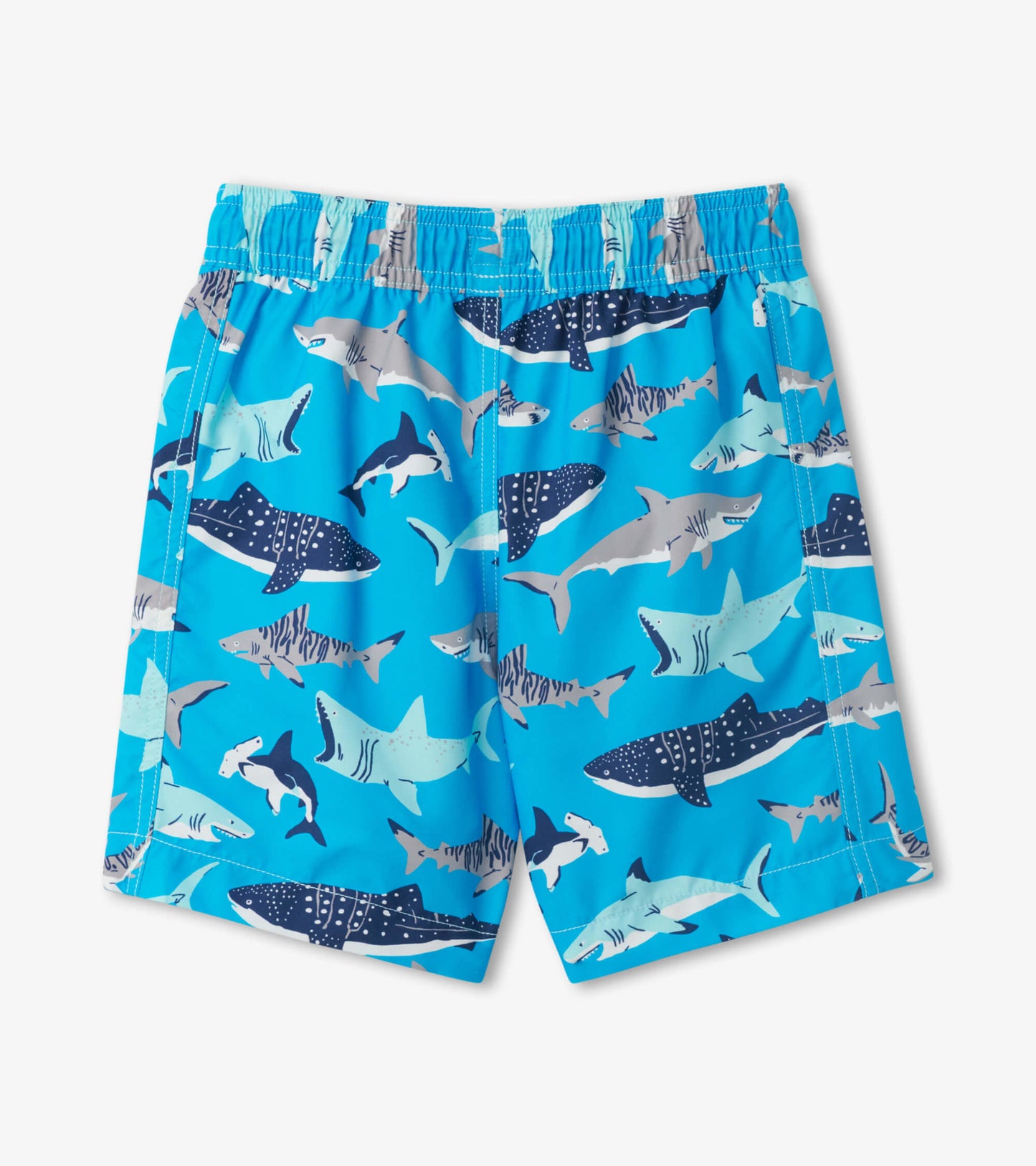 Blue swim trunks featuring a playful shark pattern in various shades, ideal for beach or pool activities.