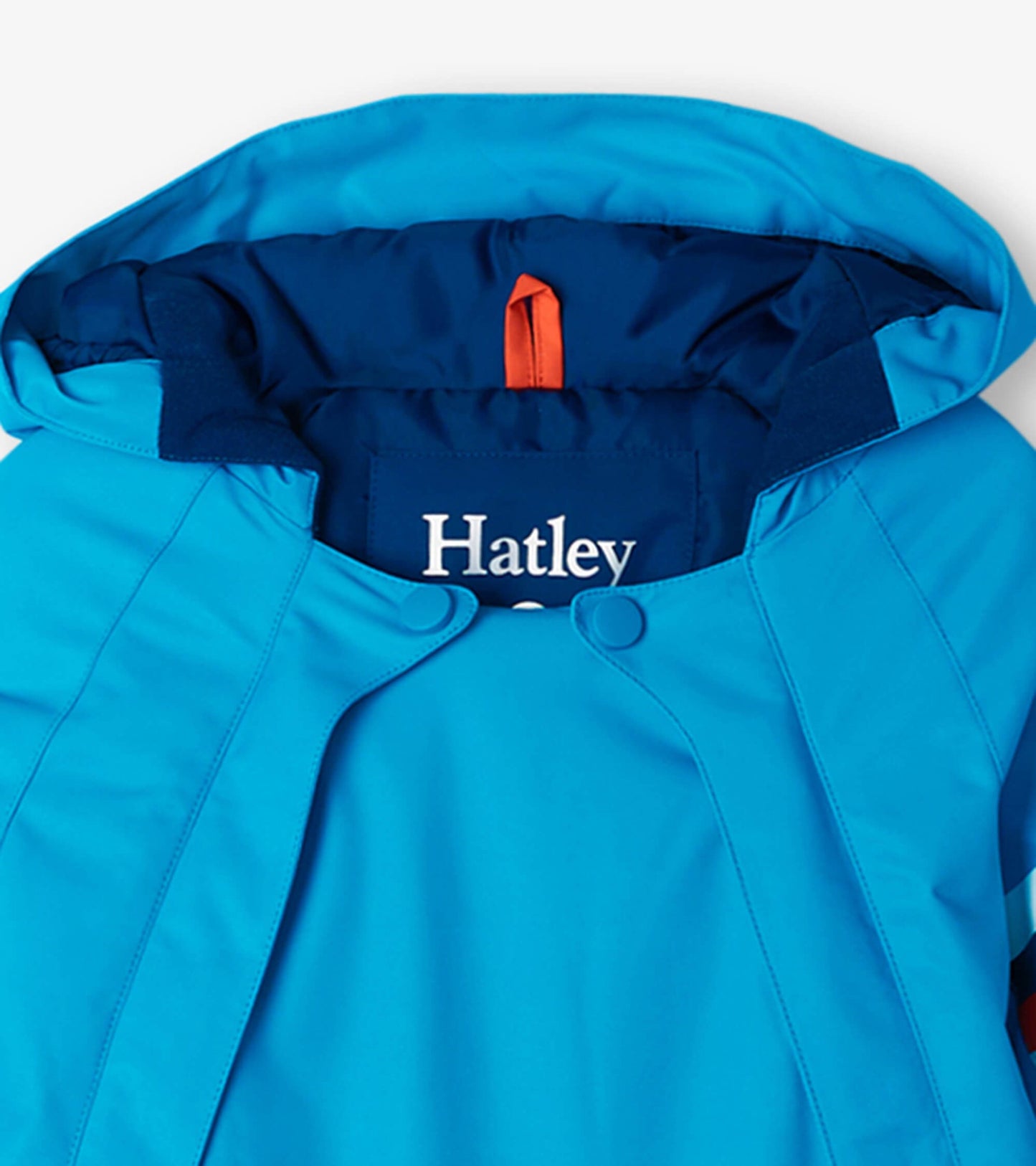 Sky blue toddler snowsuit with a hood, featuring snap closures and a soft lining for warmth and comfort.