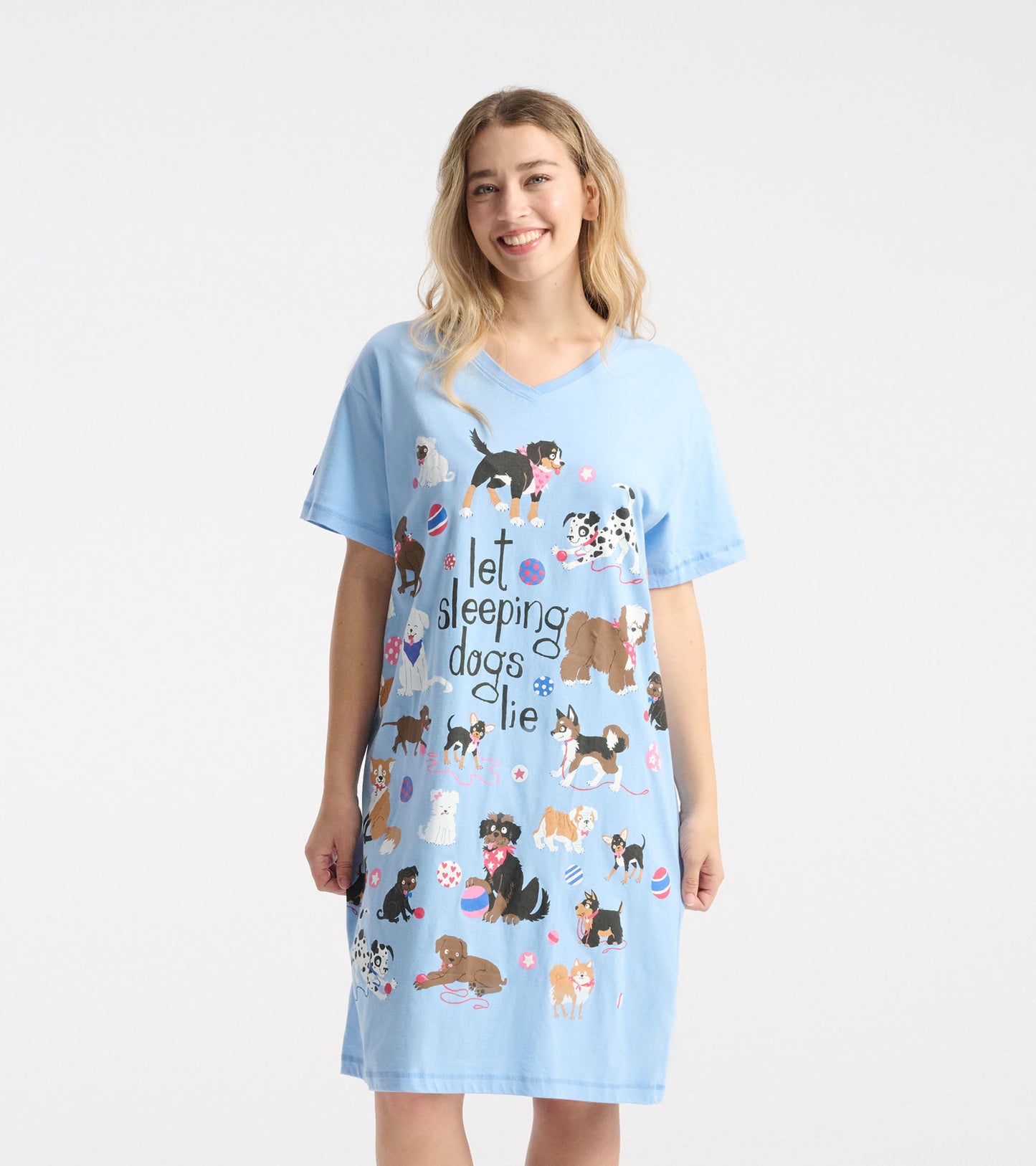 Light blue sleepshirt featuring playful dog illustrations and the phrase "let sleeping dogs lie," with a relaxed fit.