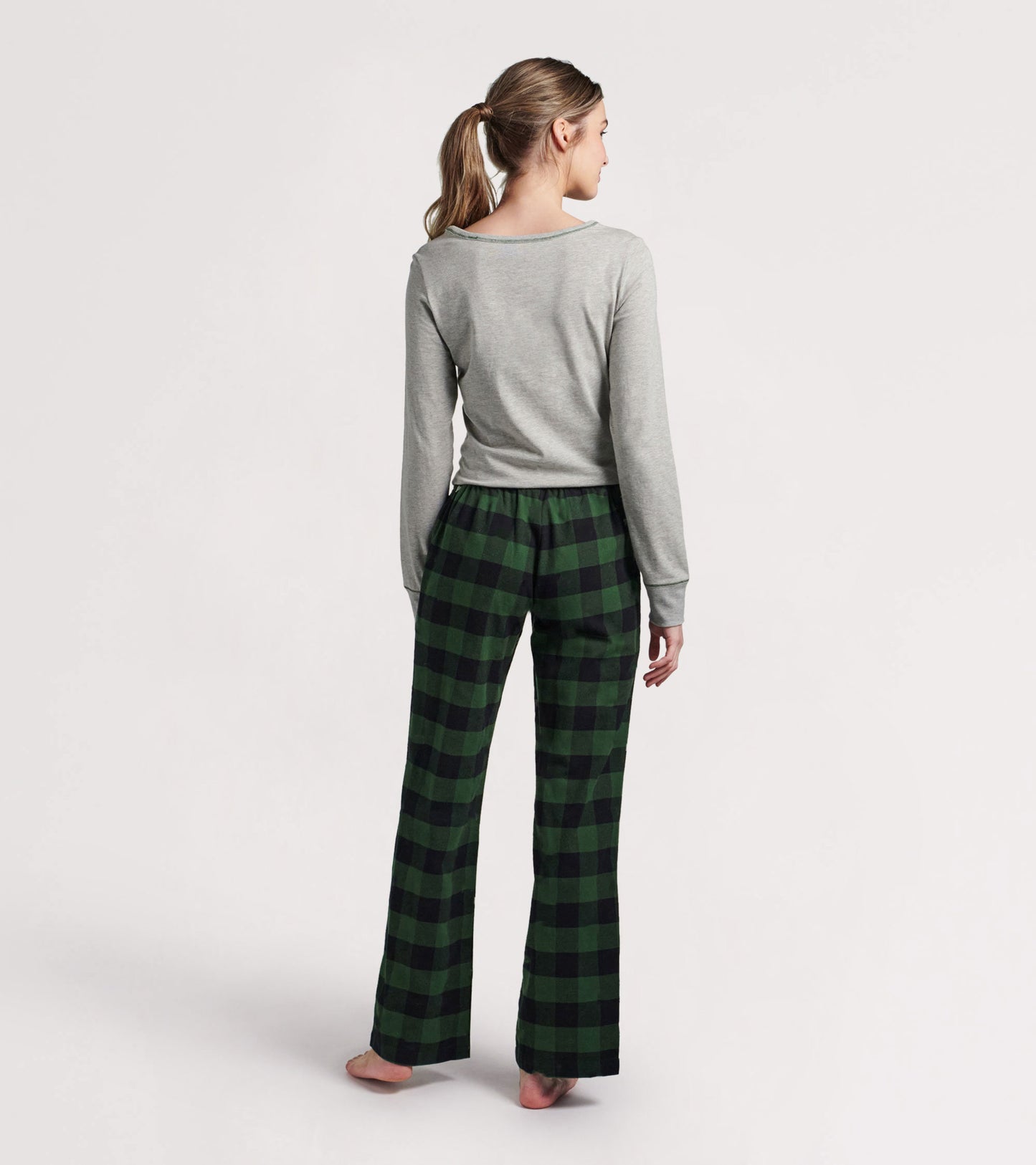 Forest green plaid stretch jersey top with long sleeves, paired with matching plaid pants, shown from the back.