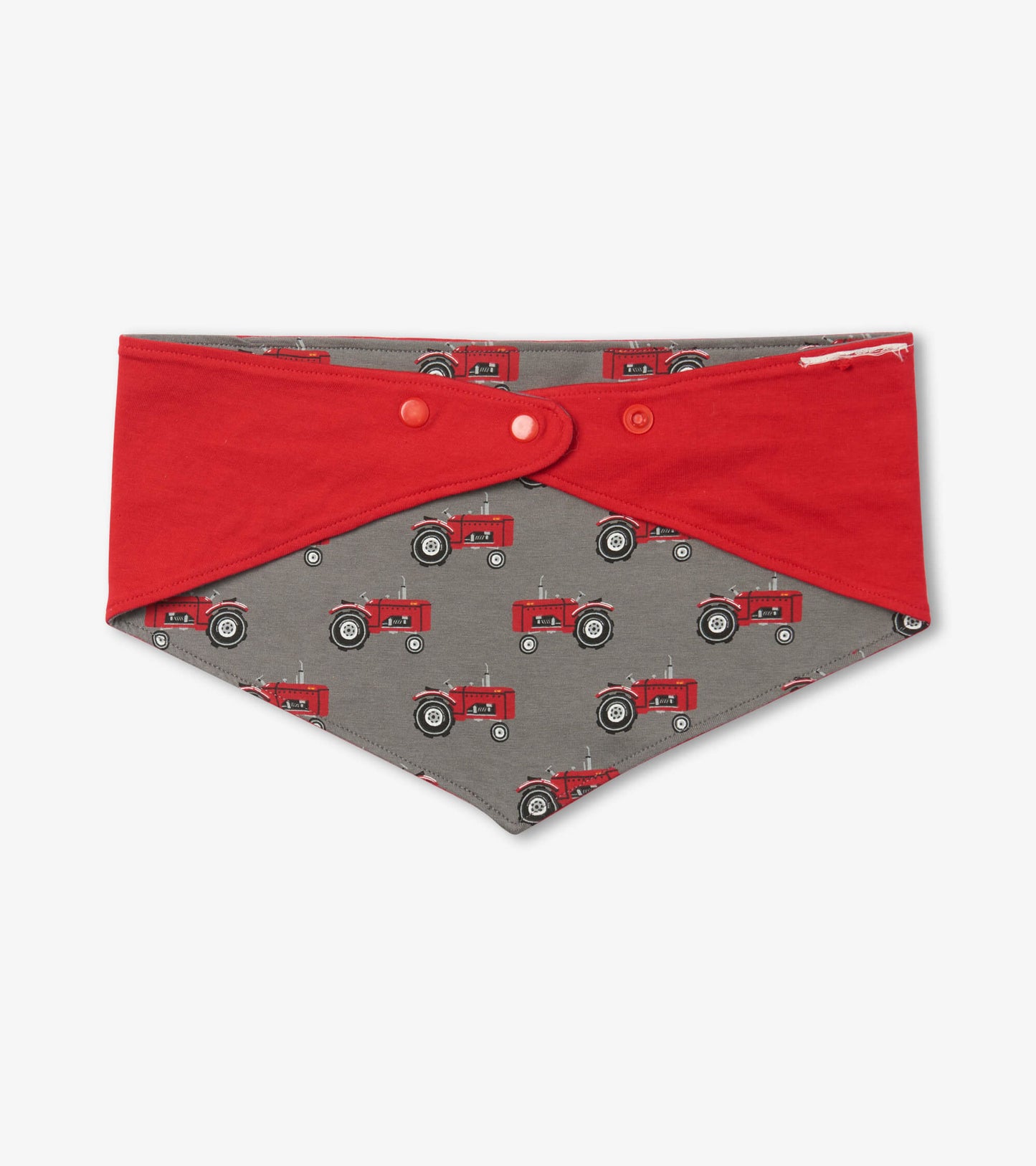 Reversible dog bandana featuring red and gray fabric with tractor print, ideal for stylish pet wear.