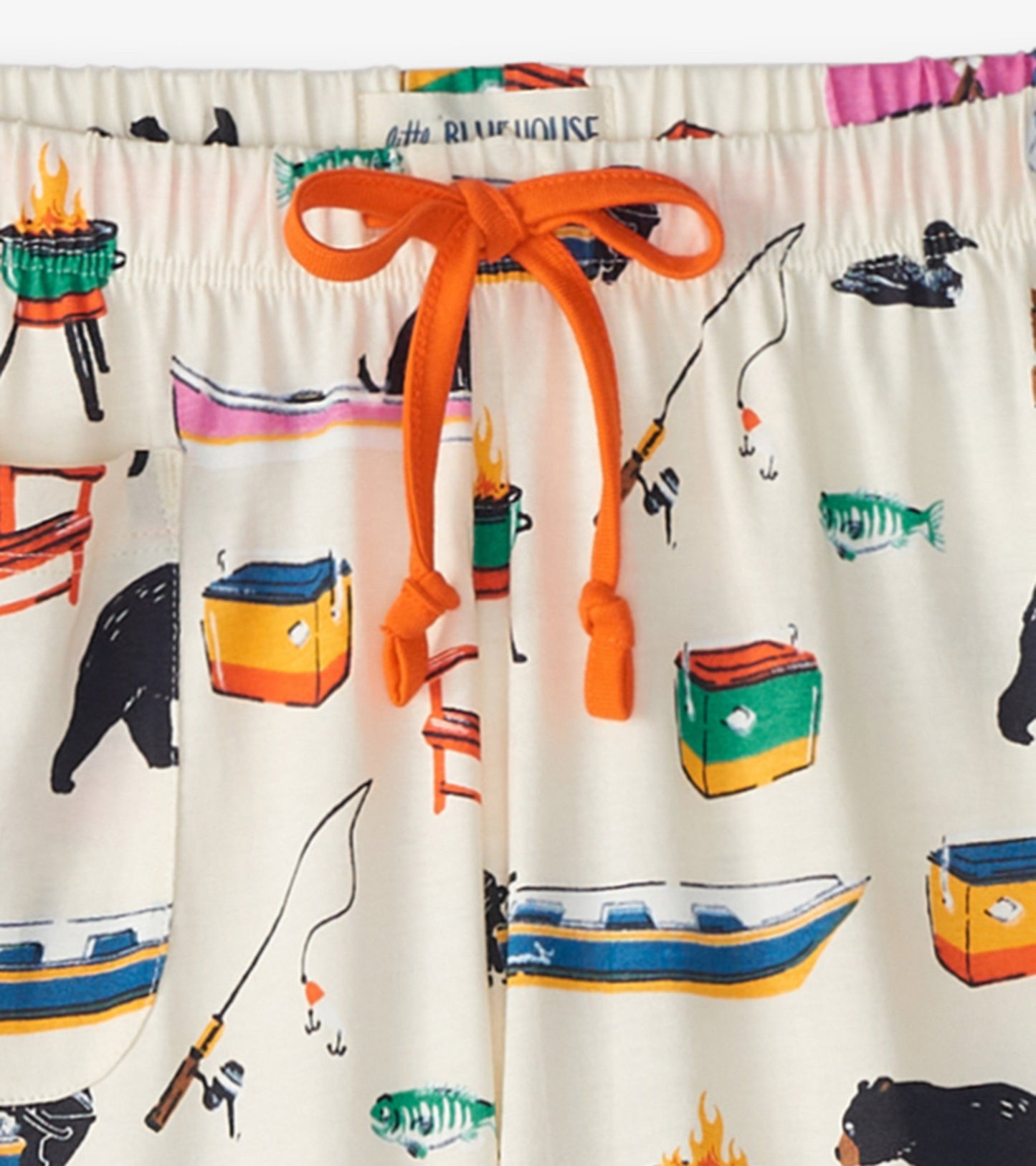 Cream cotton pajama pants featuring a colorful lake-themed print with fishing, bears, and boats, finished with an orange dra…