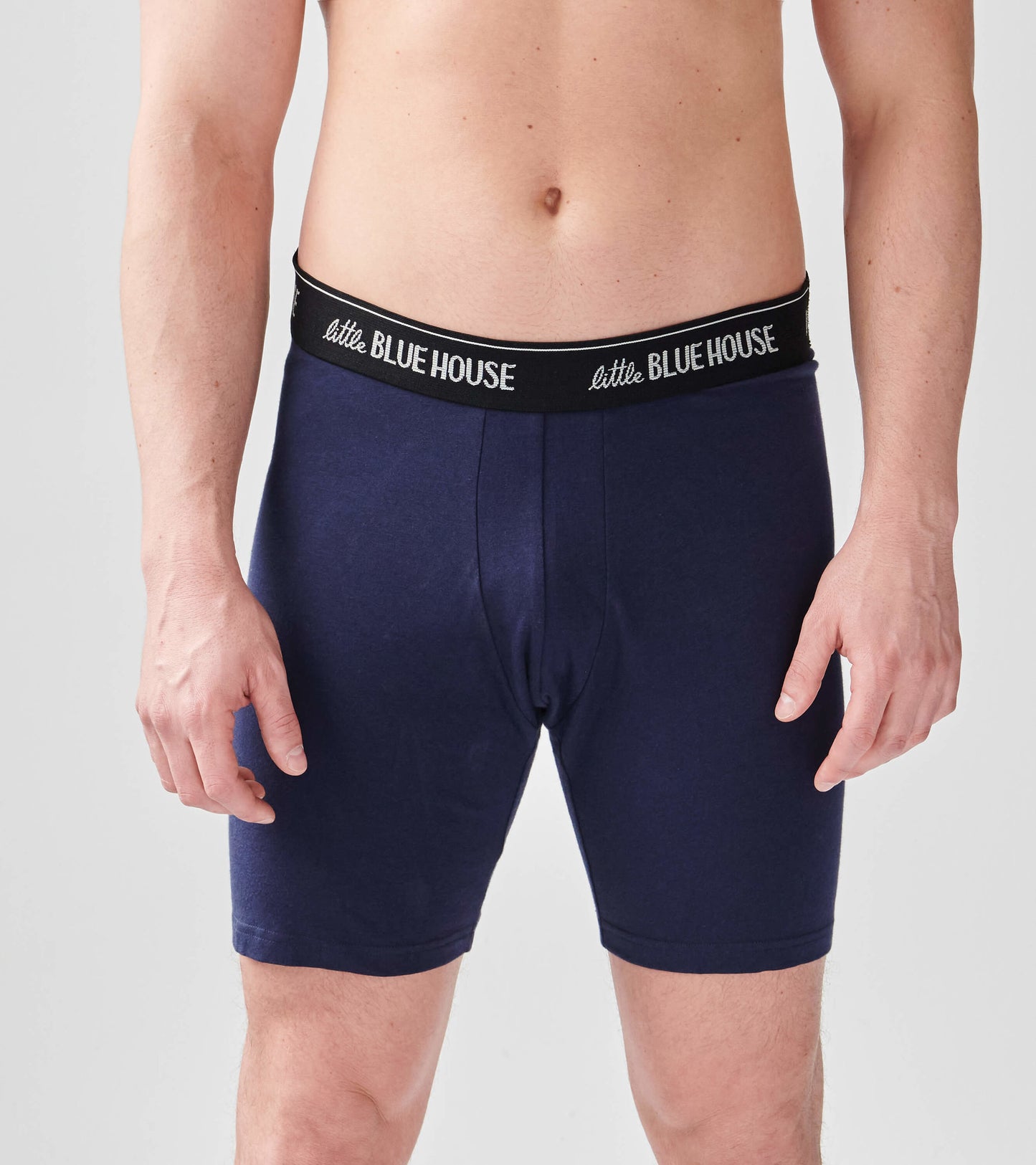 Navy blue men's boxer briefs with a black waistband, featuring a snug fit and soft fabric.