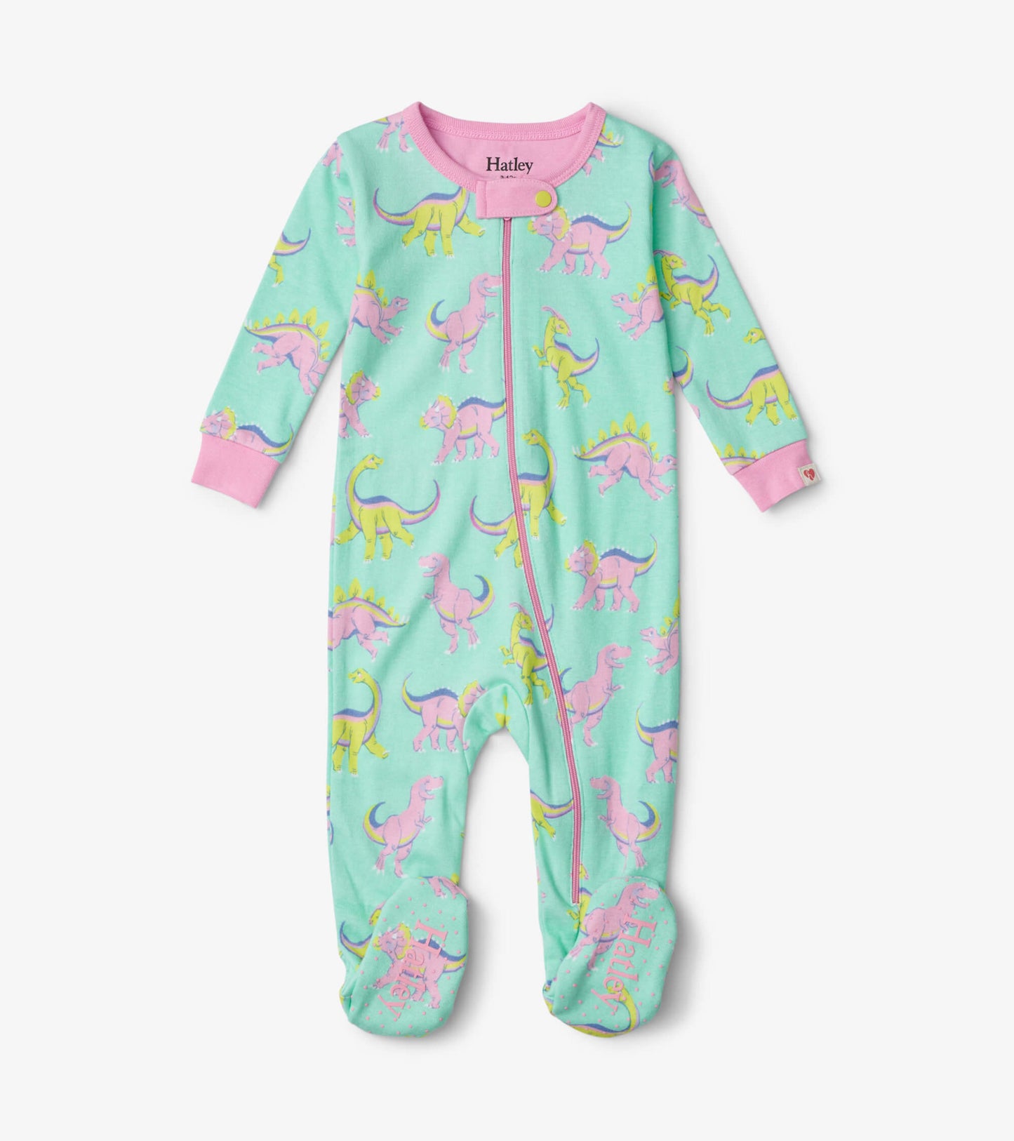Footed sleeper in mint green with colorful dinosaur print, featuring pink cuffs and a front zipper for easy dressing.