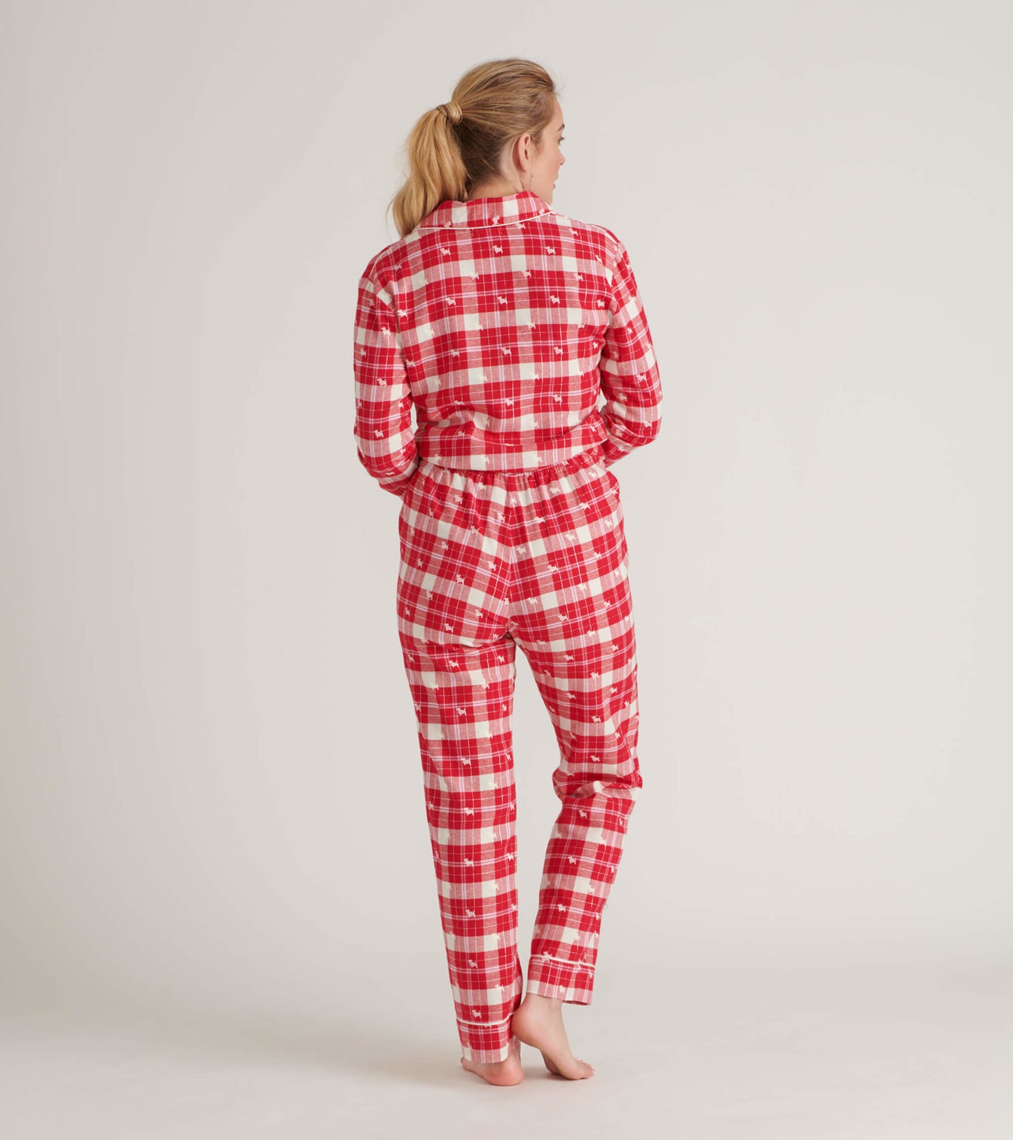 Red and white plaid flannel pajama set with a button-up top and elastic waistband pants, shown from the back.