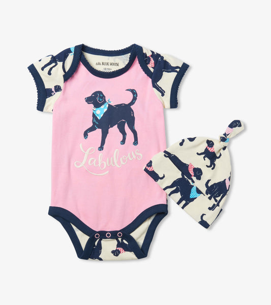 Pink baby bodysuit with dog print and navy trim, paired with a matching hat featuring the same design.