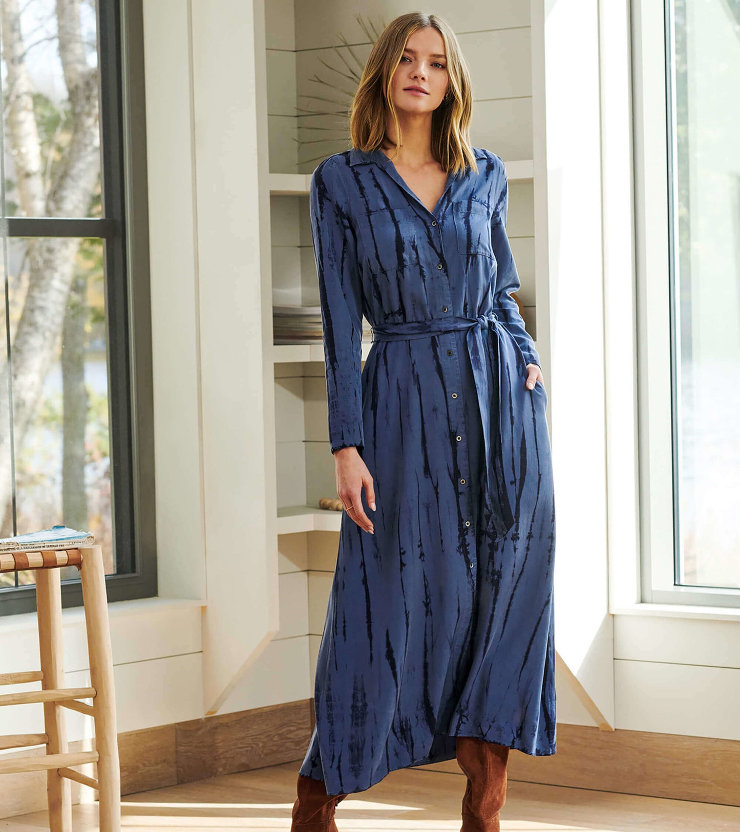Long sleeve maxi shirt dress in deep blue with a tie waist and button front, featuring a subtle tie-dye pattern.