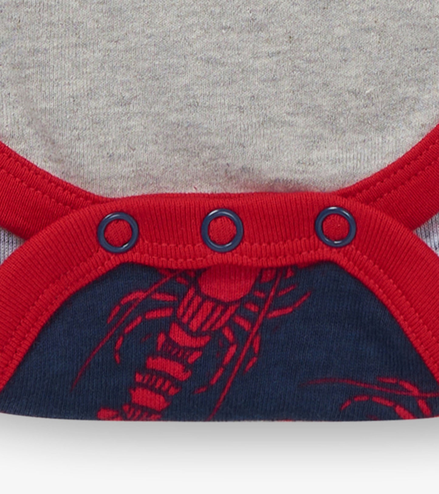 Red and navy lobster-patterned baby bodysuit with snap closures and a soft gray fabric. Suitable for infants 3-24 months.