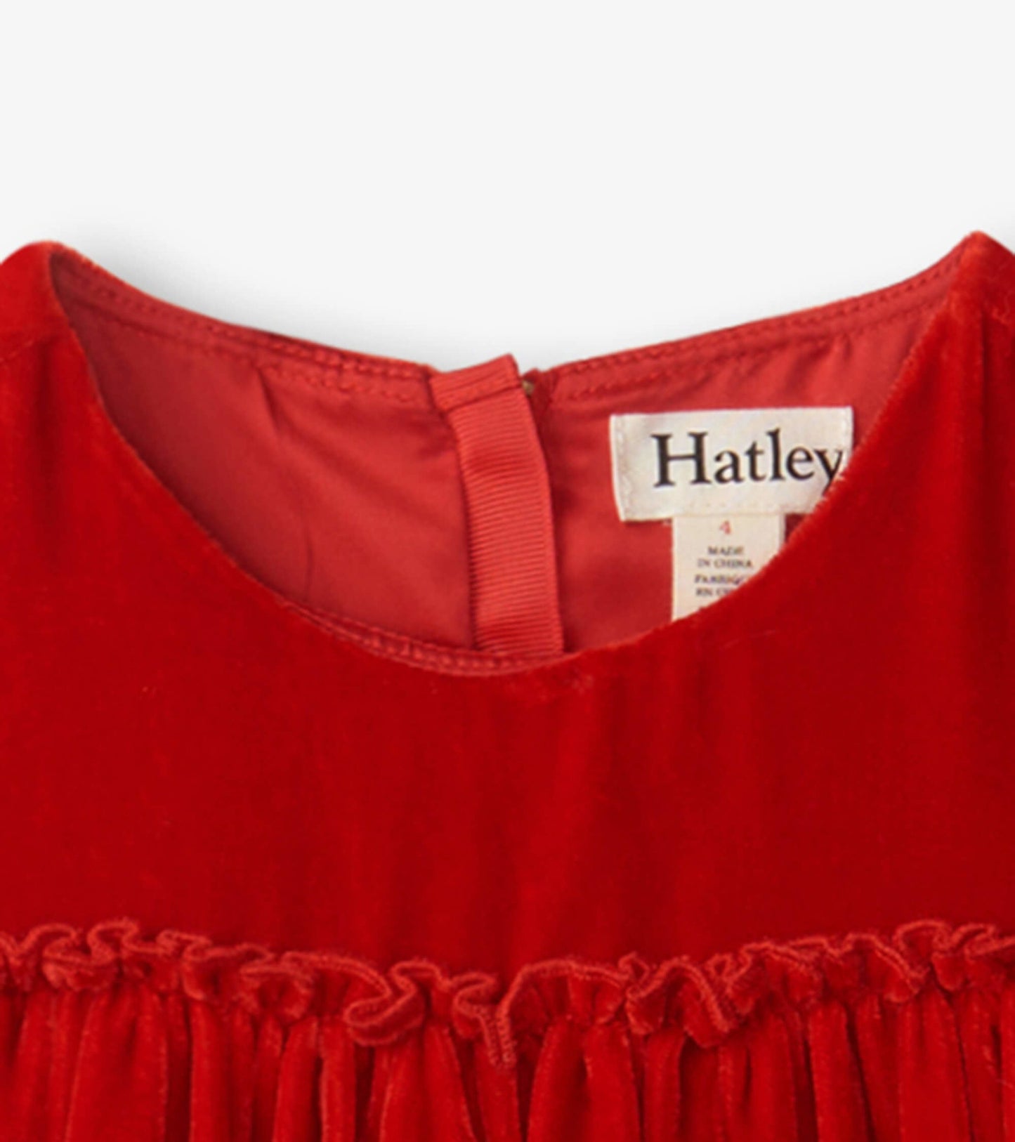 Red velvet dress featuring a smocked panel and a round neckline.