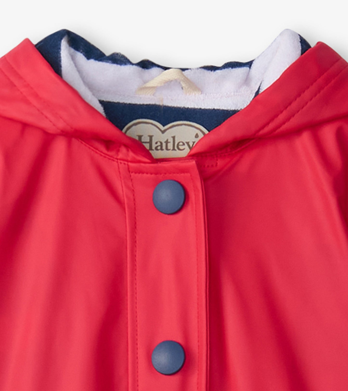 Red rain jacket with a navy hood, featuring blue buttons and a soft lining. Ideal for kids.