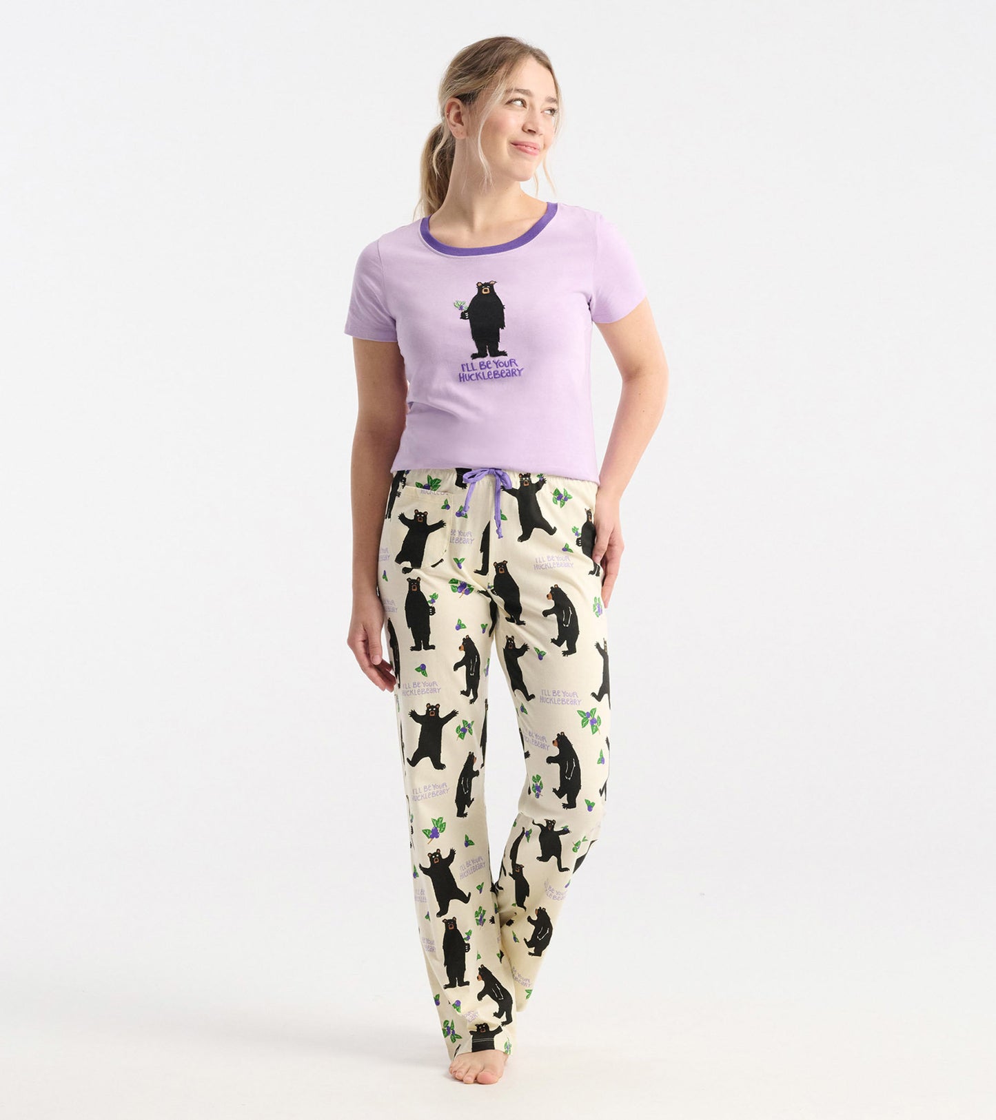 Women's cotton pajama pants featuring a playful bear pattern on a cream background, with a comfortable fit and drawstring wa…