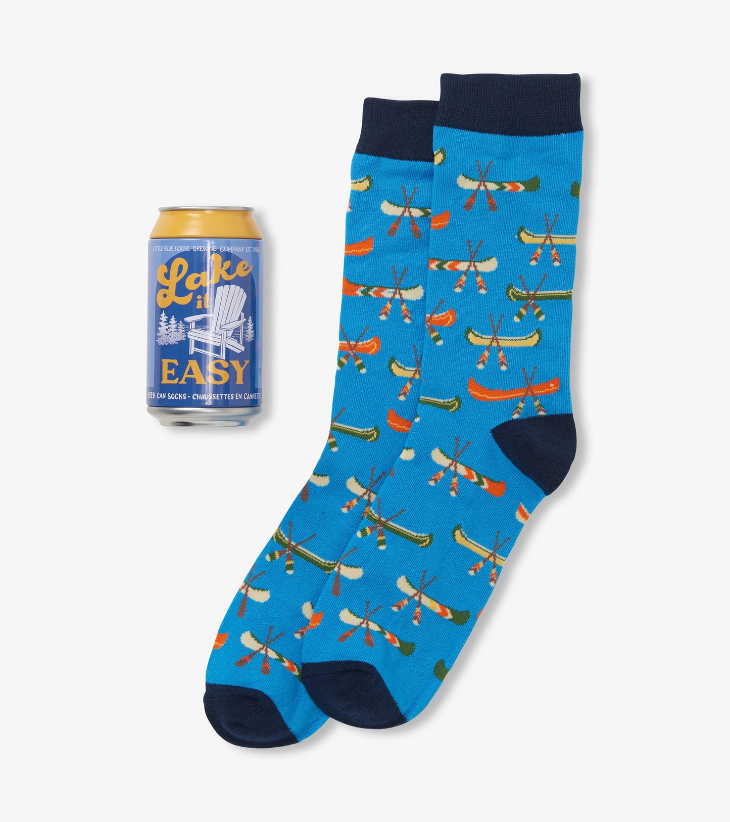 Blue socks featuring colorful canoe and paddle patterns, paired with a beer can for scale.