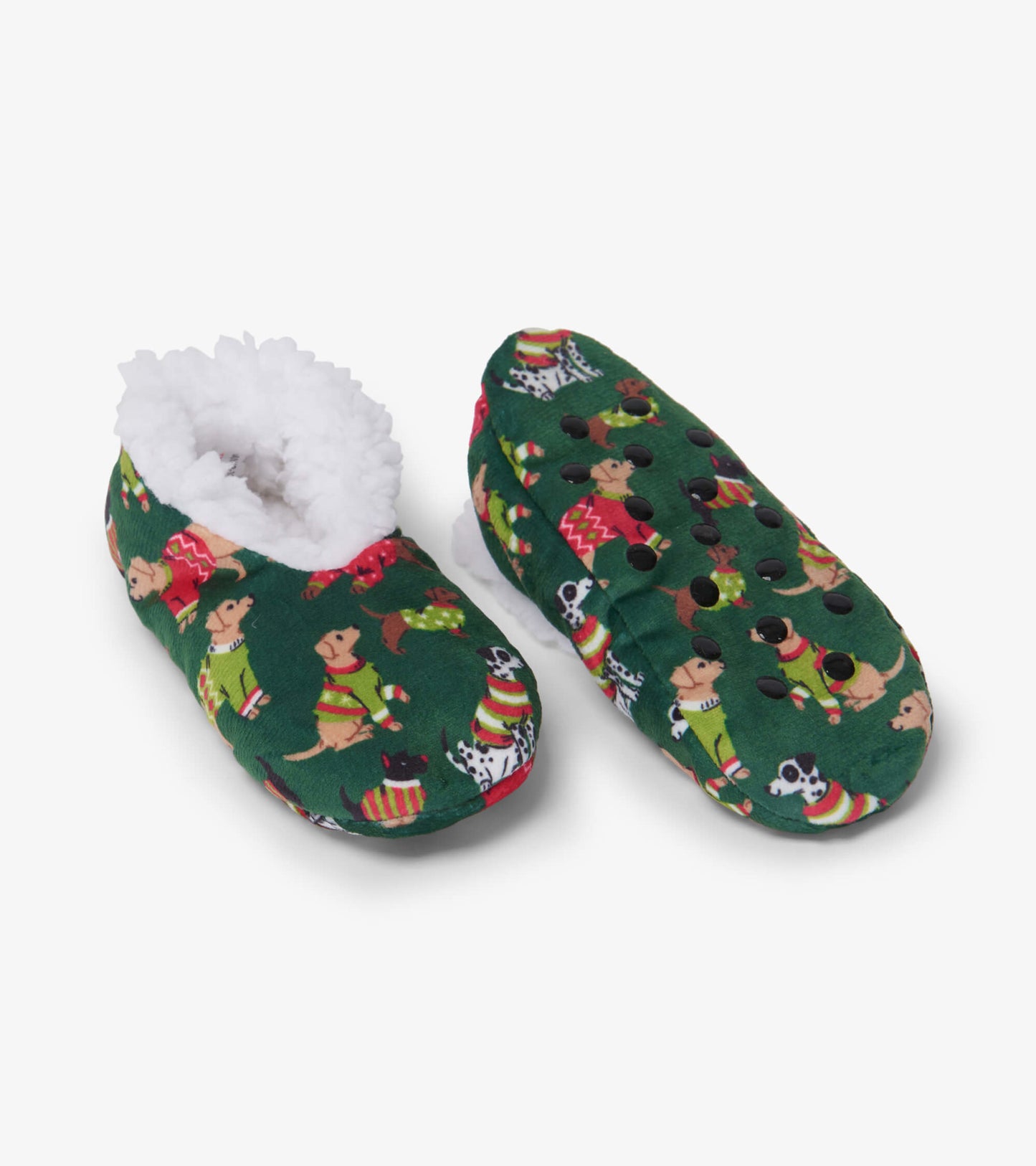 Green slippers with a cozy white lining, featuring a playful dog pattern, ideal for kids during Christmas.