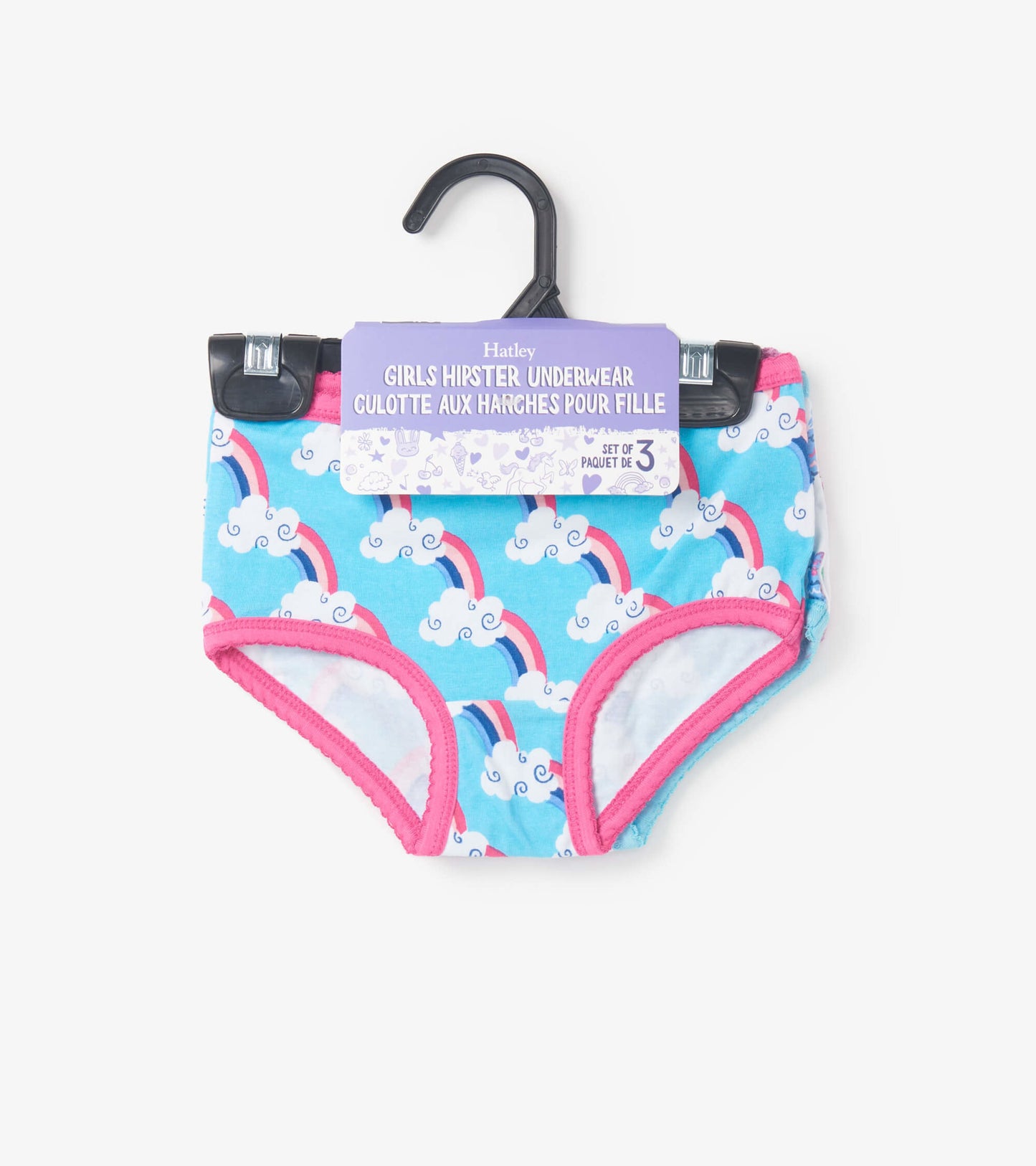 Girls' hipster underwear in blue with rainbow and cloud pattern, featuring pink trim and elastic waistband.