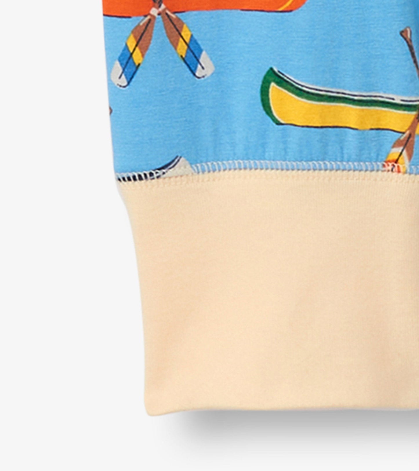 Light blue sleep leggings featuring a colorful canoe and paddle print, with a soft beige cuff at the bottom.