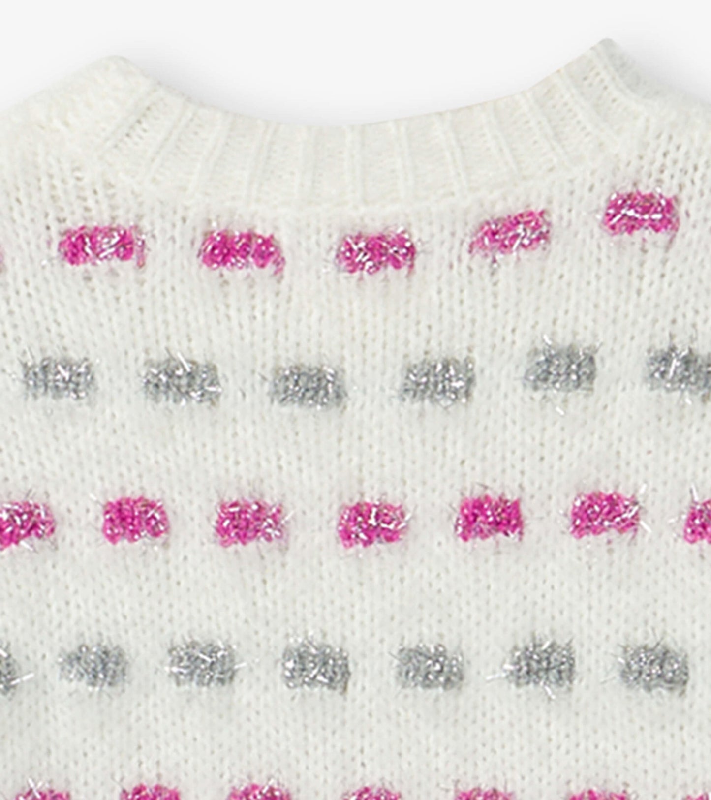 White sweater tunic featuring a basket weave pattern with pink and silver accents. Round neckline and soft texture.