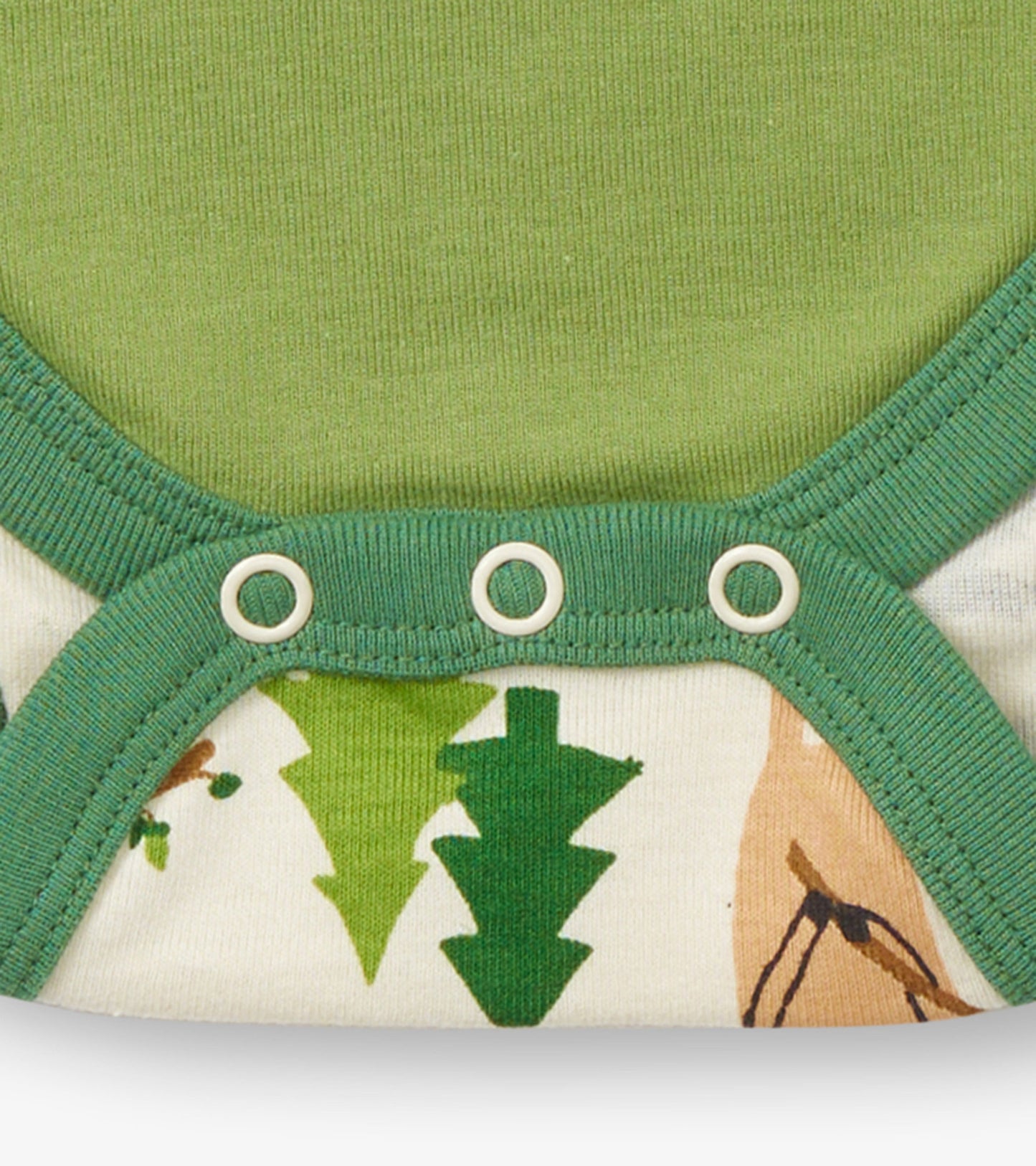 Green and cream baby bodysuit featuring forest-themed prints and snap closures at the bottom.
