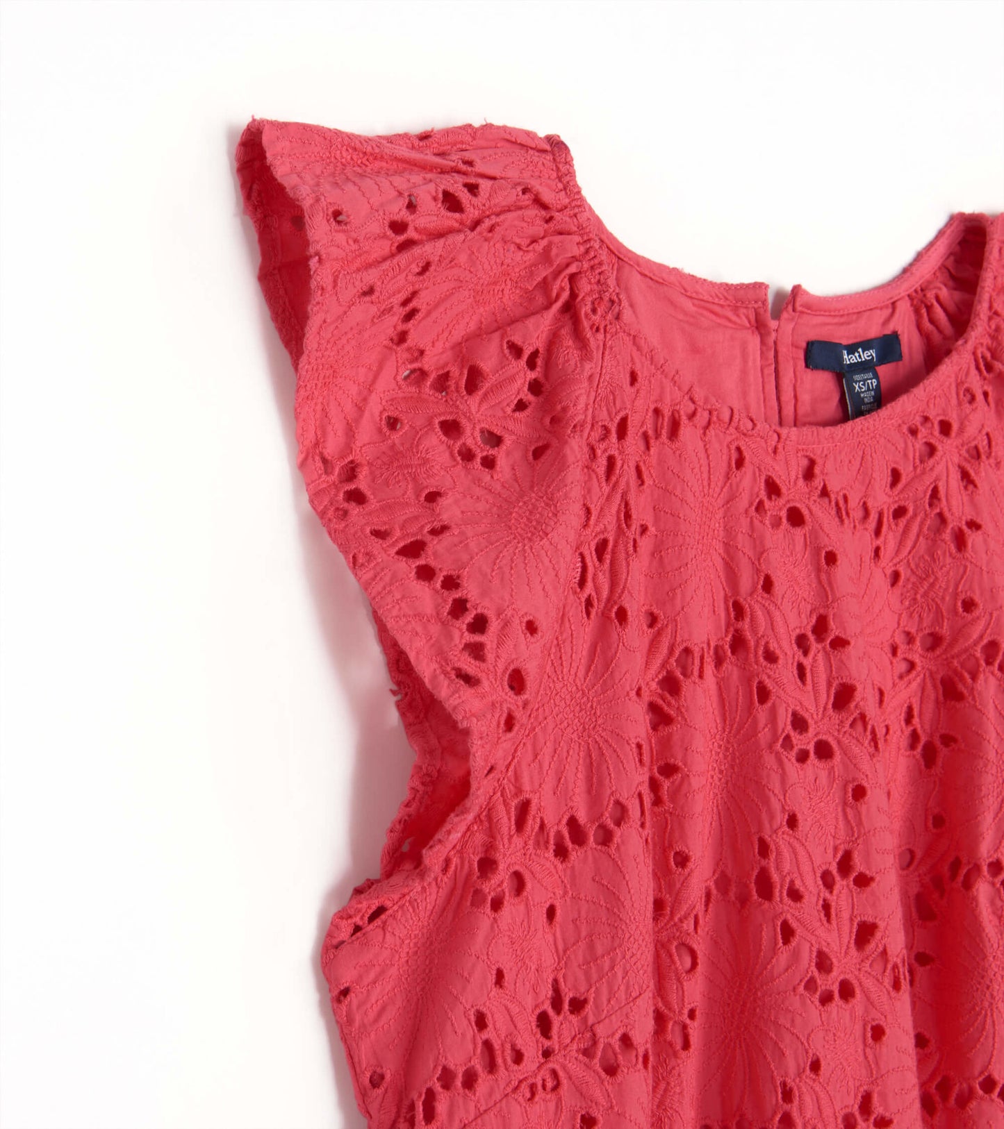 Rouge red eyelet dress featuring floral patterns and flutter sleeves, with a back zipper closure.