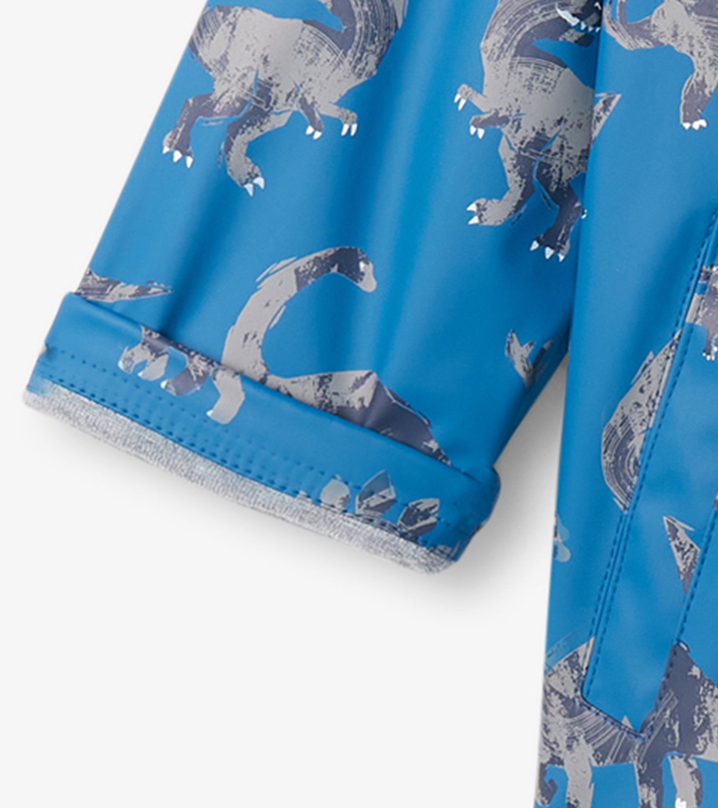 Blue zip-up rain jacket featuring a dinosaur pattern, designed for boys, with a soft lining and elastic cuffs.
